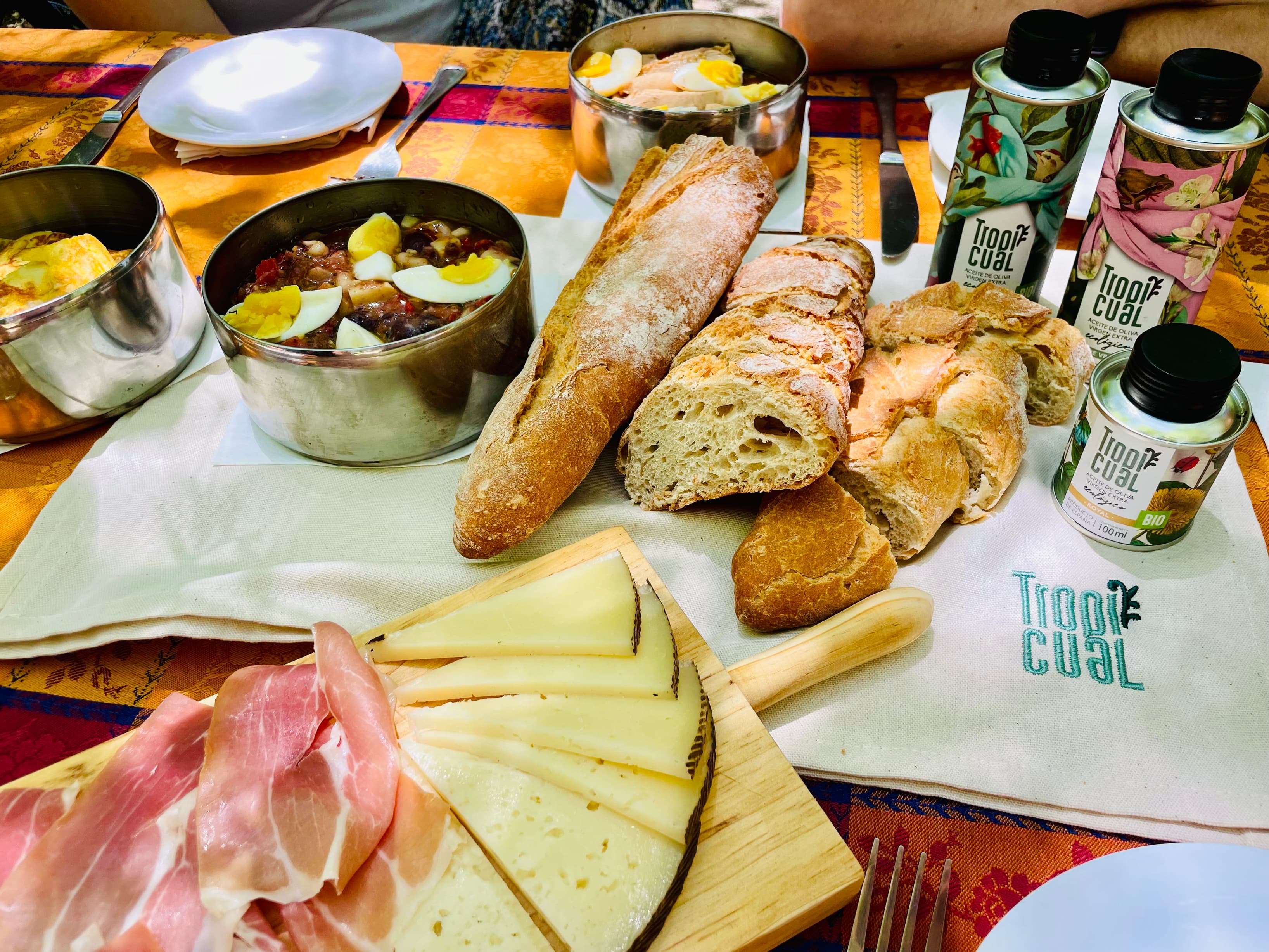 A beautifully prepared riverside picnic featuring homemade Spanish specialties, local wines and artisanal products, set in na A beautifully prepared riverside picnic featuring homemade Spanish specialties, local wines and artisanal products, set in na