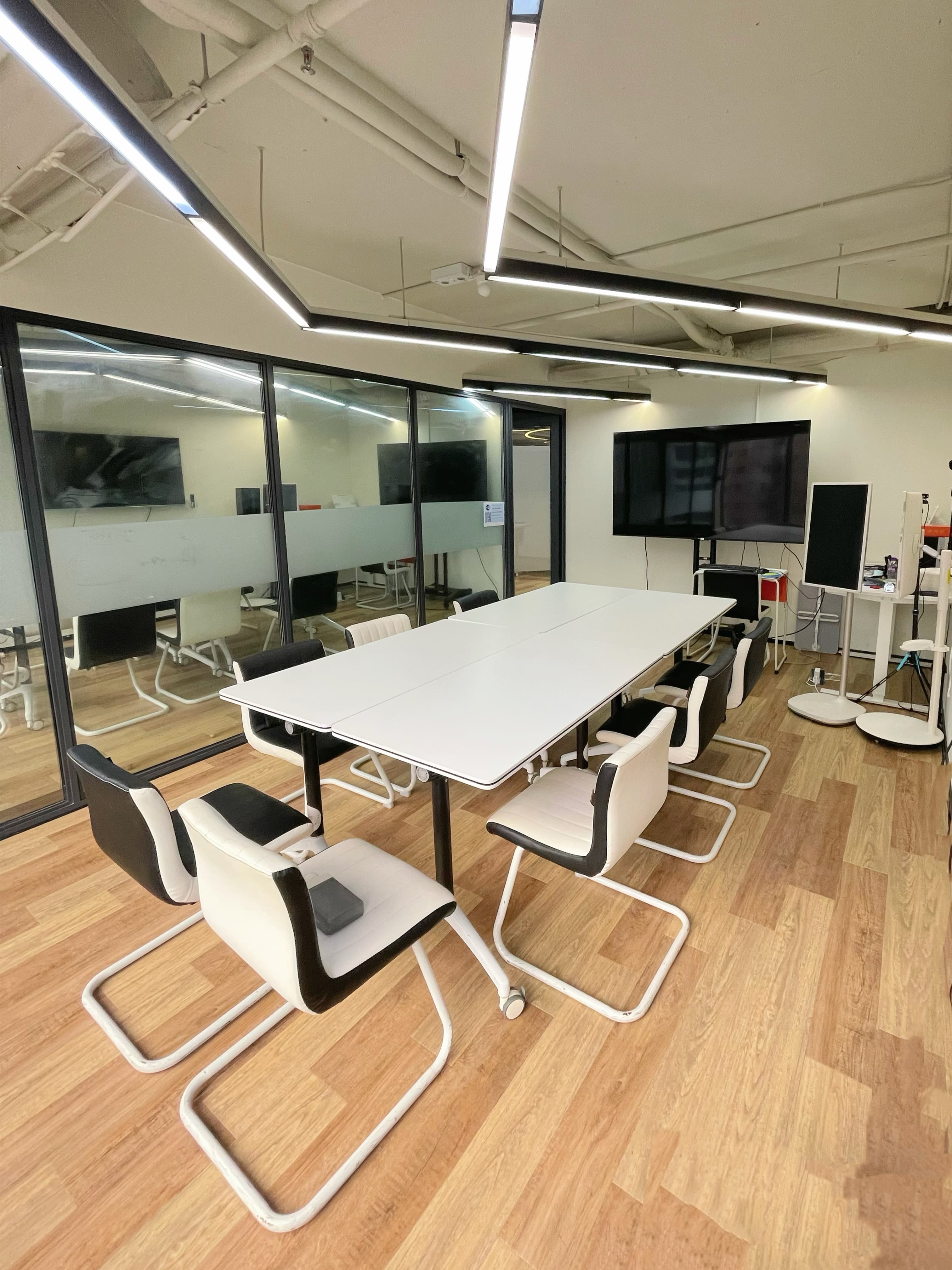Meeting Room for 10-15 people; Comes with one large display screen and two portable smaller screens. Meeting Room for 10-15 people; Comes with one large display screen and two portable smaller screens.