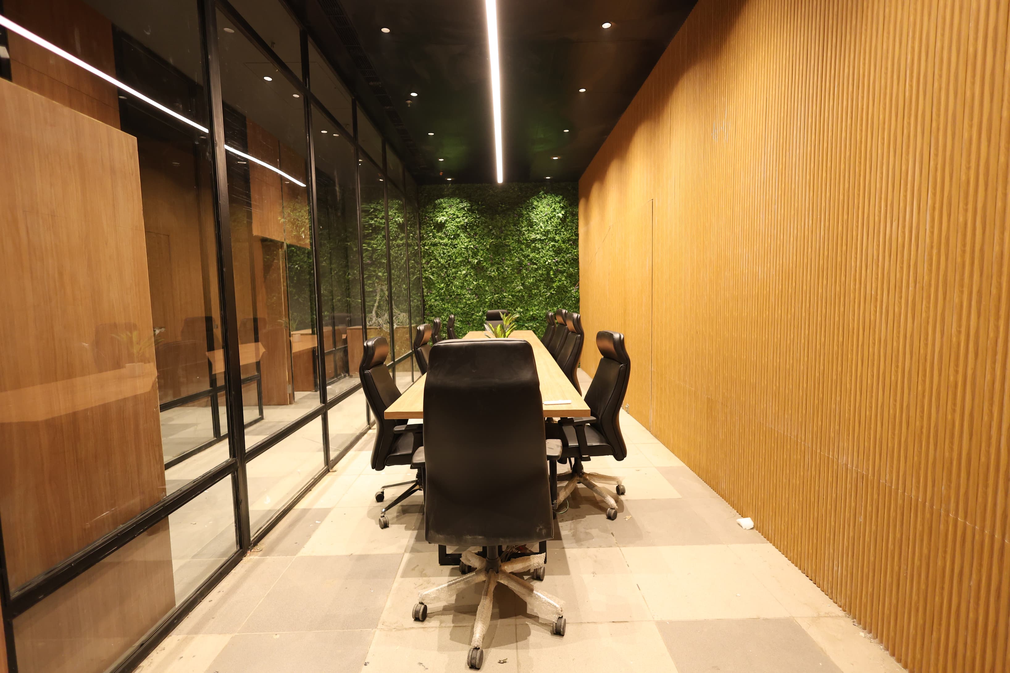 A fully equipped conference room for up to 14 people, available hourly, ideal for presentations, strategy sessions, workshops