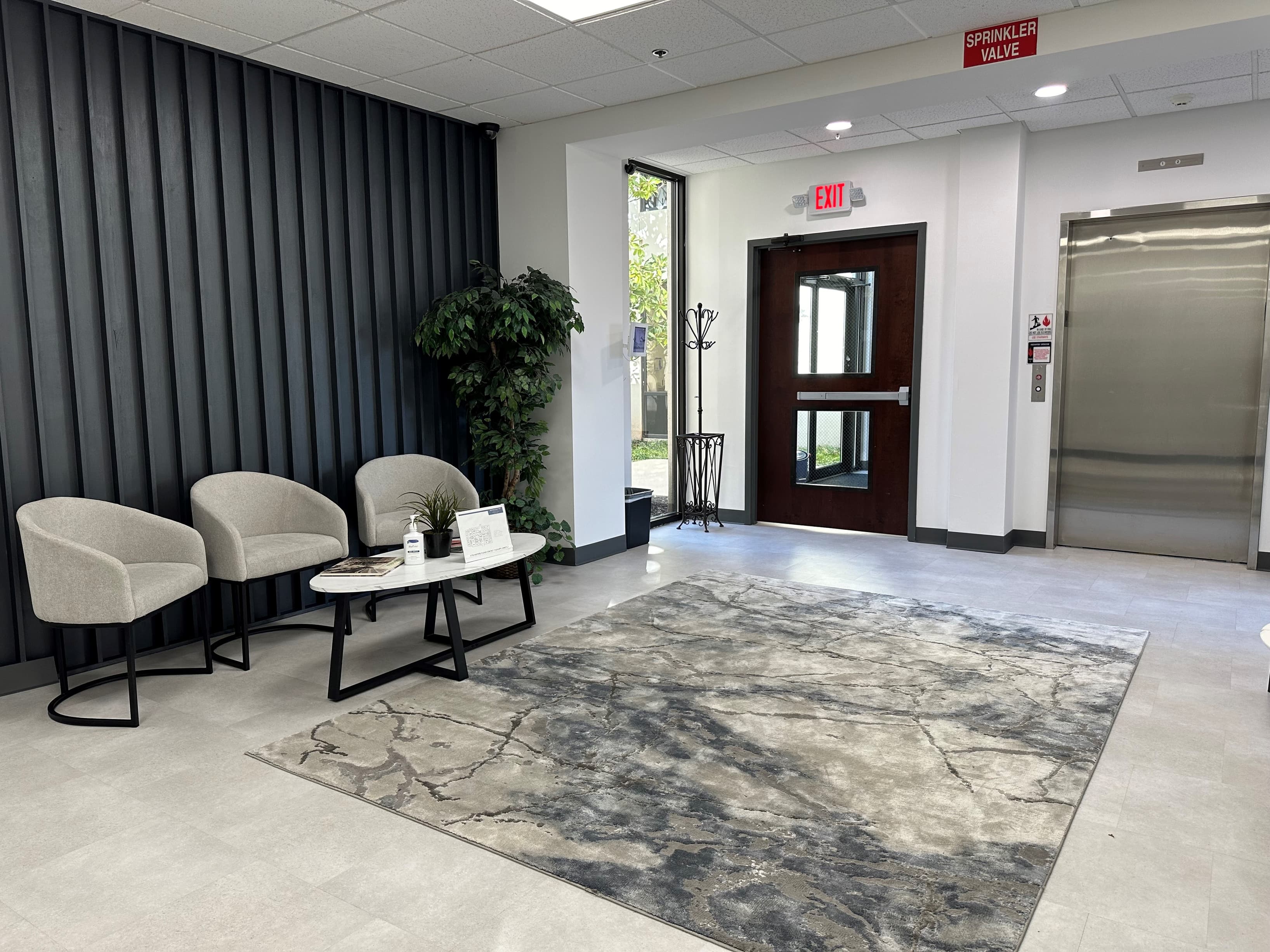 Modern lobby with iPad check-in system for visitor alerts Modern lobby with iPad check-in system for visitor alerts