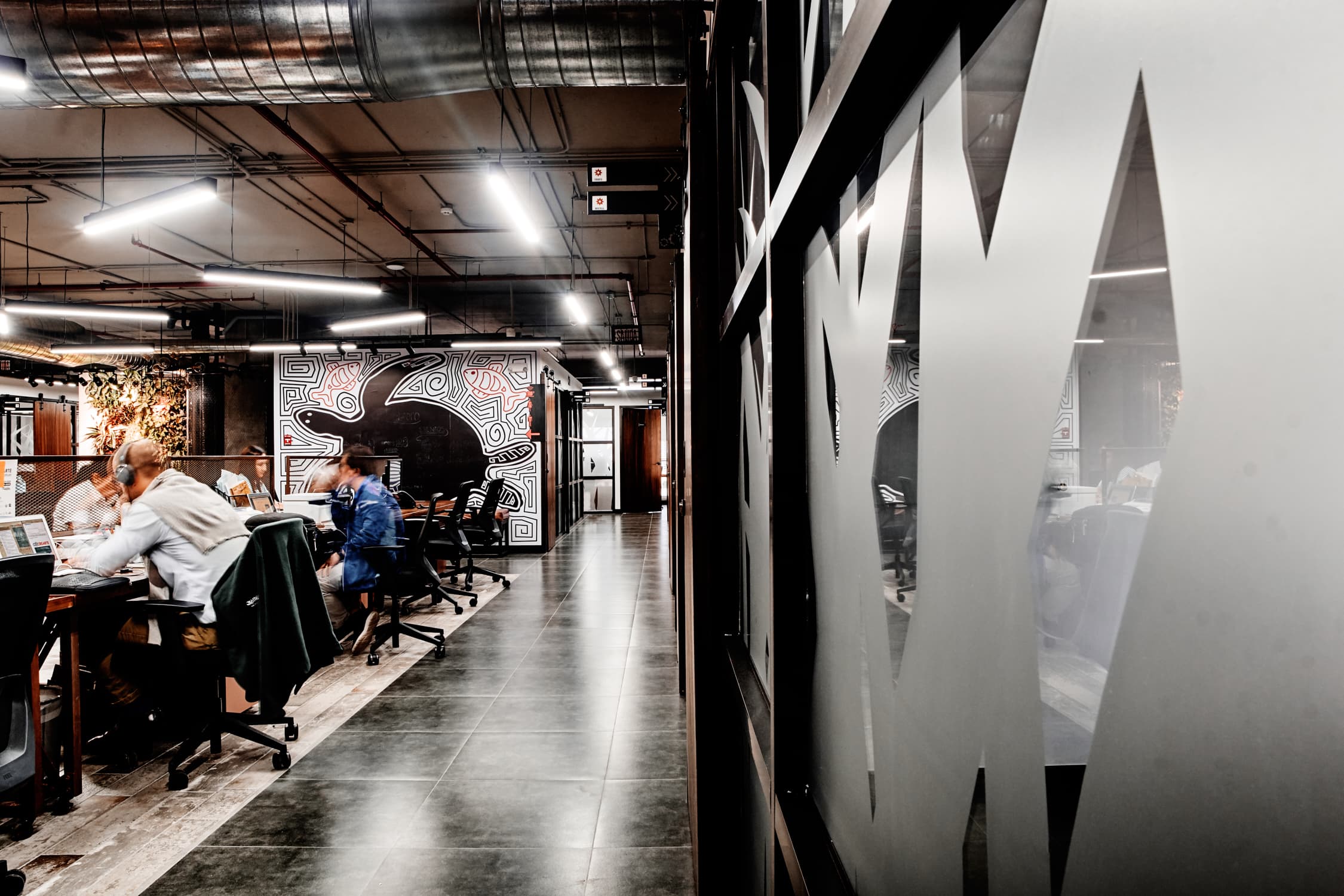 Open area with a dedicated wooden desk, filing cabinet, chair, high-speed internet, phone line, and much more.