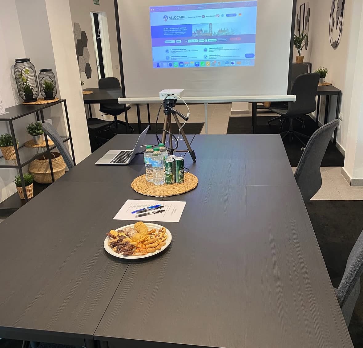 Meeting setup with projector, water and snacks