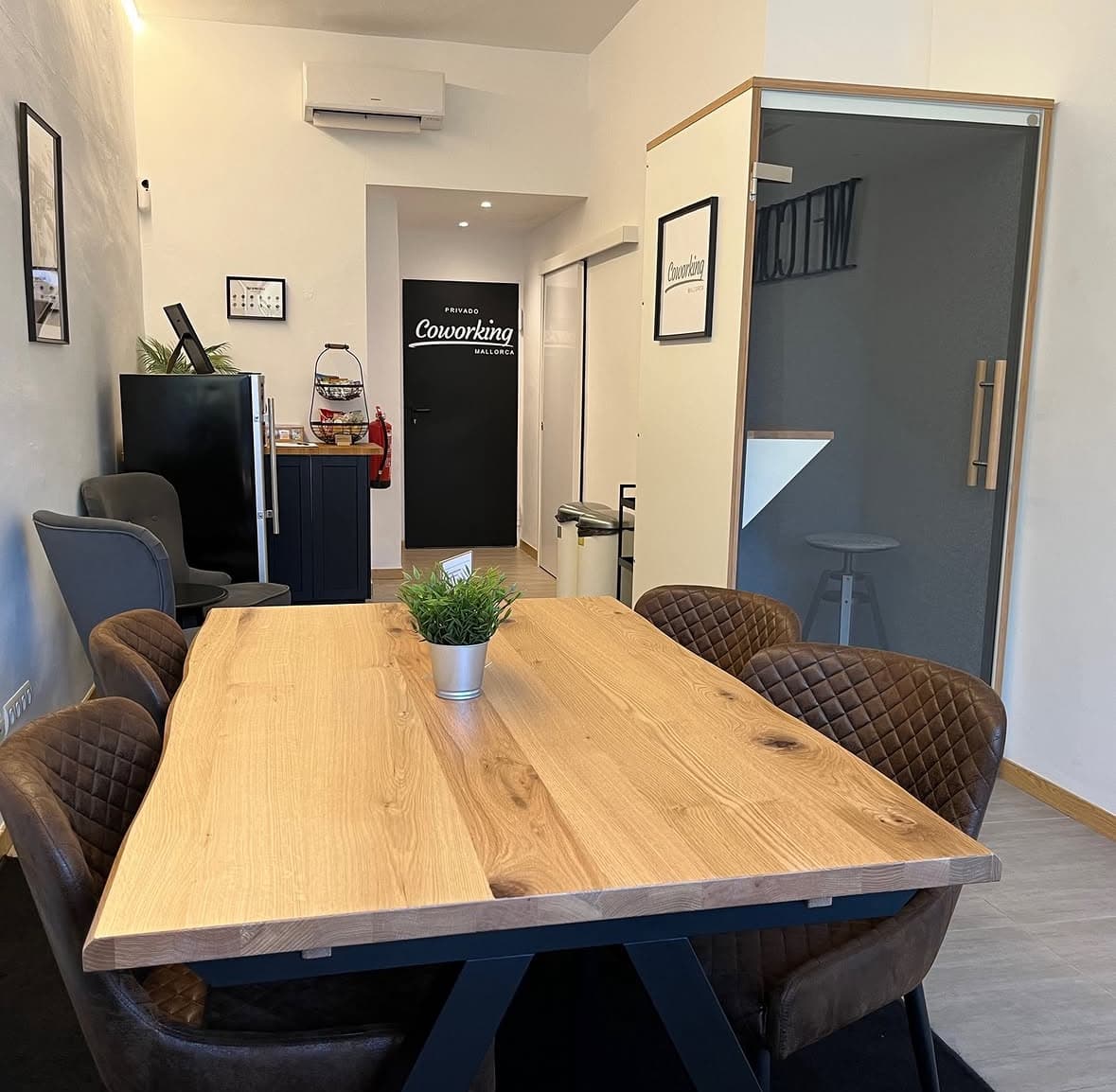 Private meeting room with phone booth and coffee area
