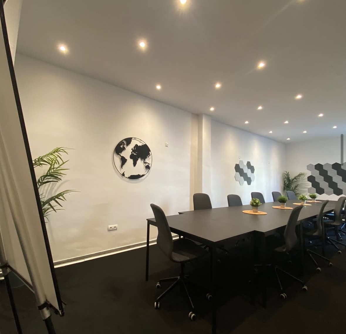 Spacious meeting room with modern desks and a calm setup