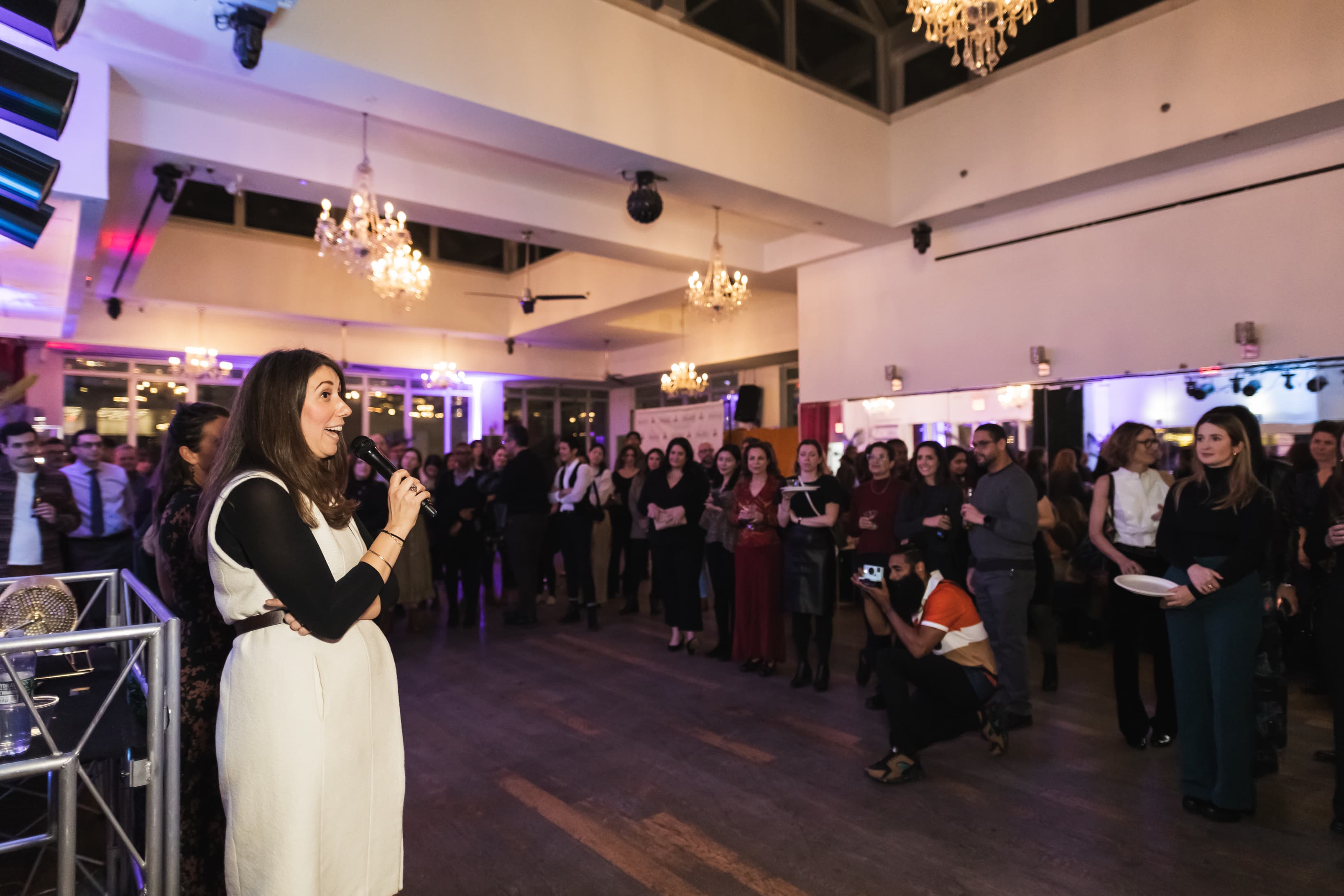 A vibrant company conference at PH with speakers and workshops under chandeliers in a fun, upscale atmosphere. A vibrant company conference at PH with speakers and workshops under chandeliers in a fun, upscale atmosphere.