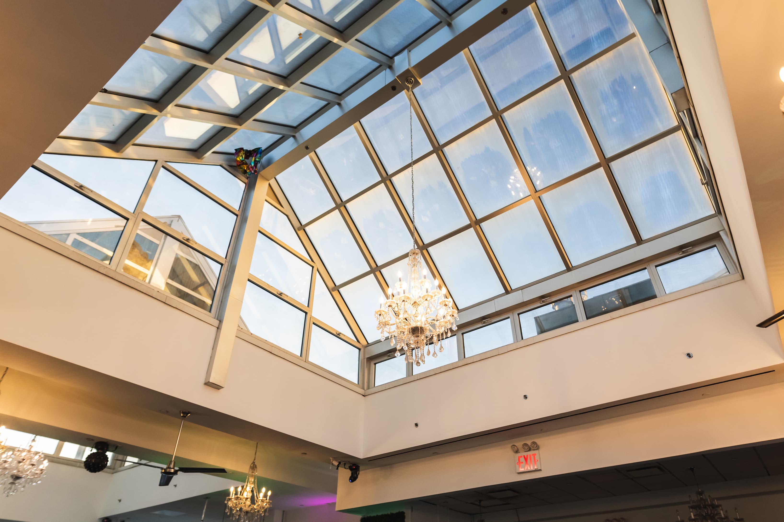 The Penthouse’s glass atrium glows with daylight or chandeliers, creating a bright, luxurious setting for any event. The Penthouse’s glass atrium glows with daylight or chandeliers, creating a bright, luxurious setting for any event.