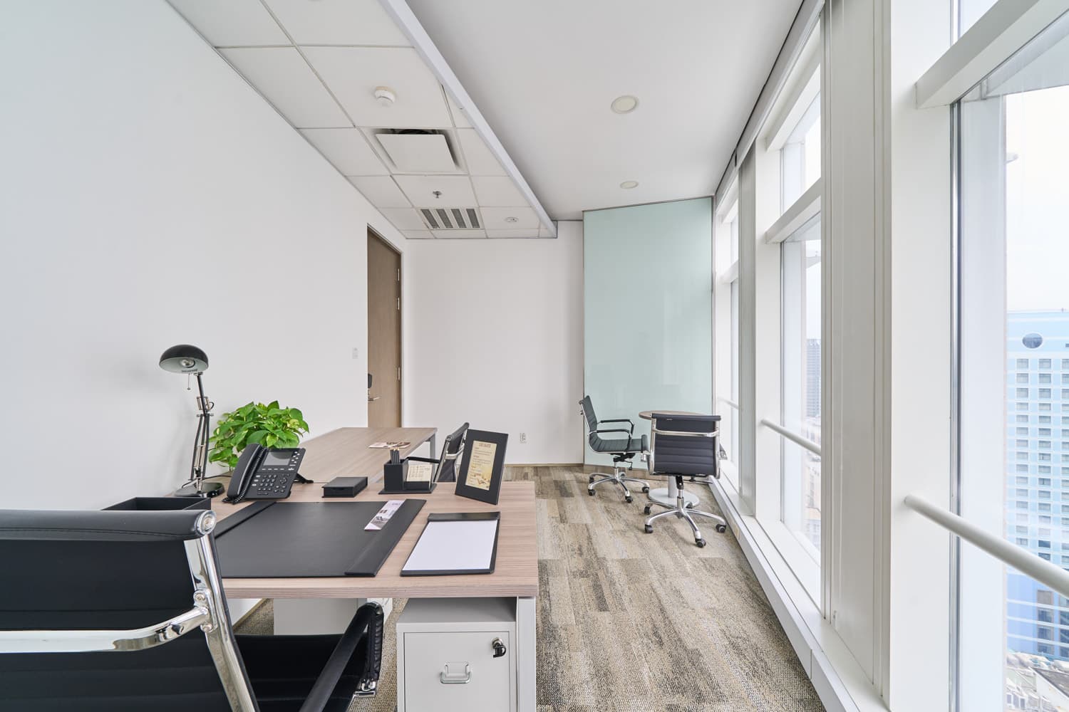 Private office with view, white board and round table Private office with view, white board and round table