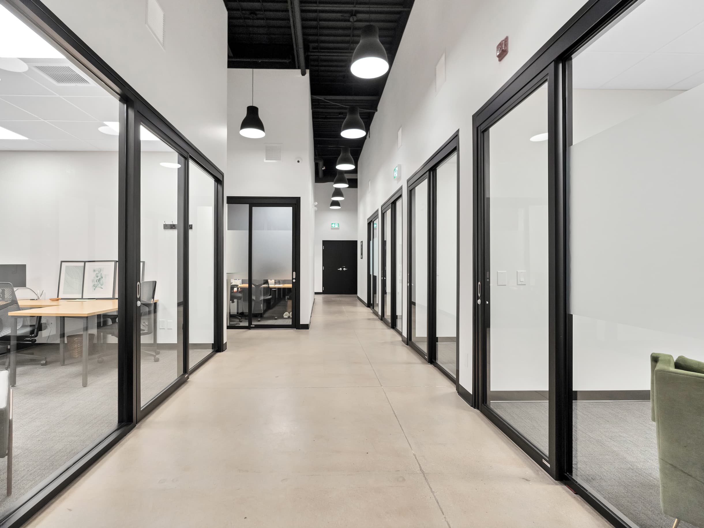 Hallway featuring private offices