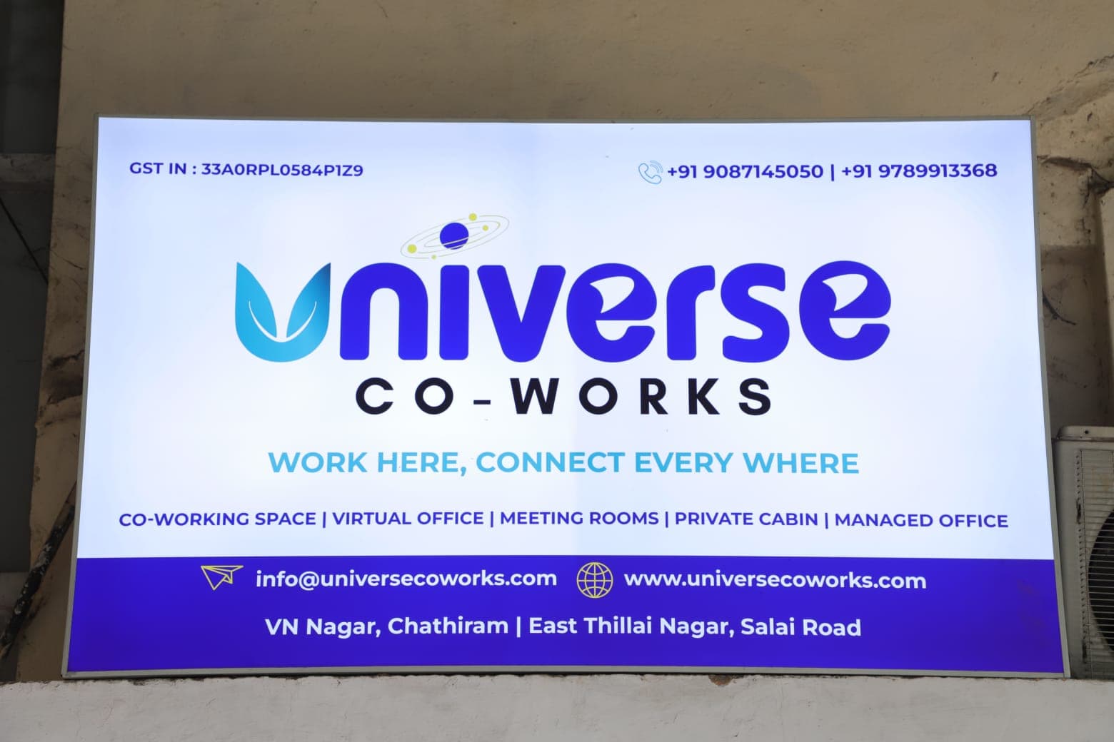 Universe Coworks flex board showcasing our full range of services — Co-working Space, Virtual Office, Meeting Rooms, Private Universe Coworks flex board showcasing our full range of services — Co-working Space, Virtual Office, Meeting Rooms, Private
