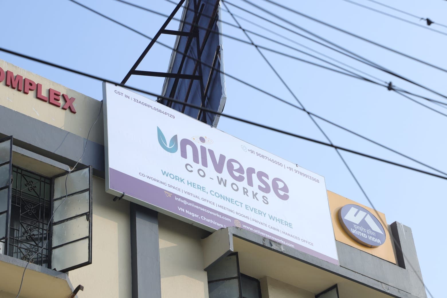 Universe Coworks outdoor hoarding at our Salai Road location — Work Here, Connect Everywhere. Serving professionals across Tr Universe Coworks outdoor hoarding at our Salai Road location — Work Here, Connect Everywhere. Serving professionals across Tr