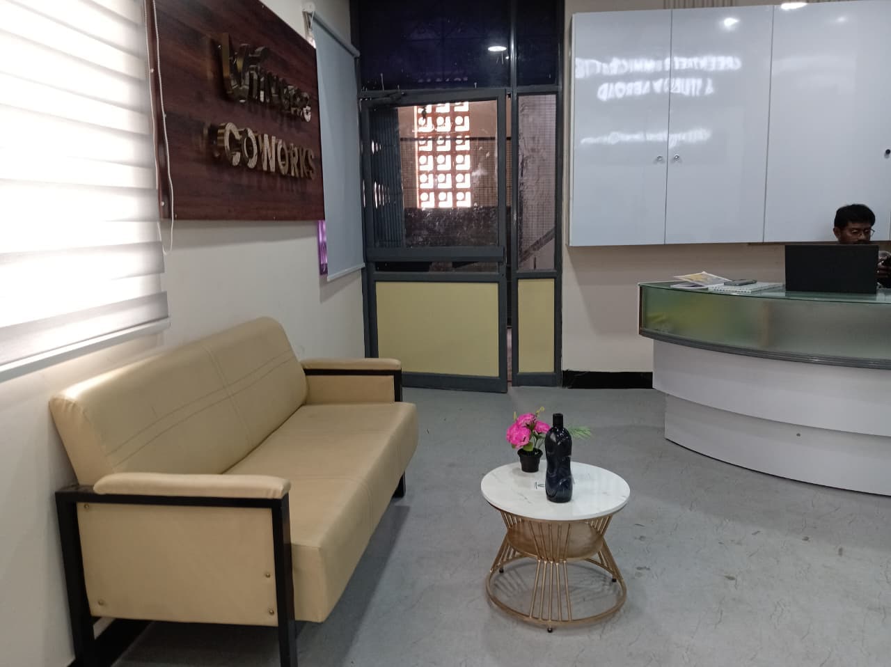 Welcoming reception area at Universe Coworks Trichy — comfortable lounge seating, dedicated front desk staff, and a projector Welcoming reception area at Universe Coworks Trichy — comfortable lounge seating, dedicated front desk staff, and a projector