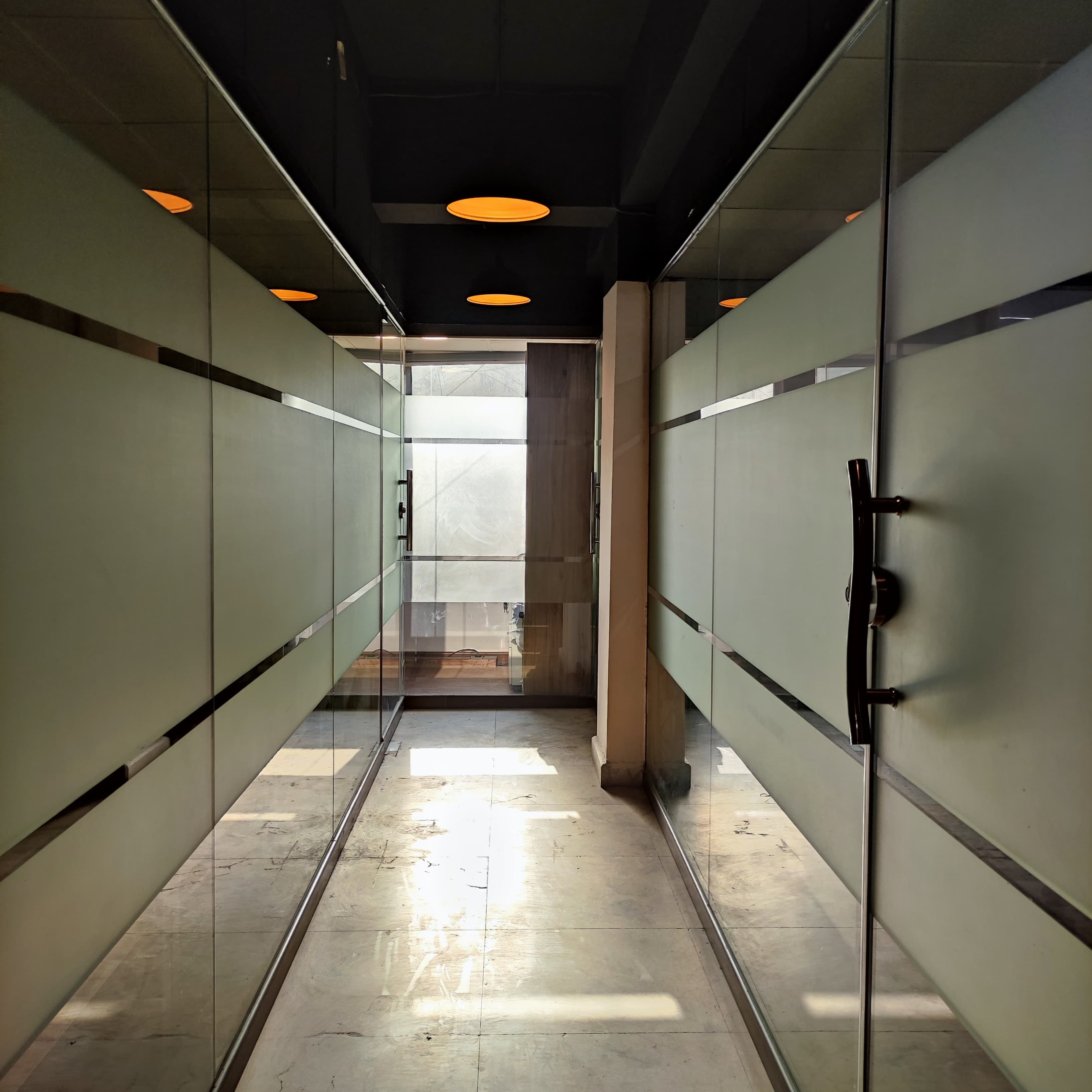 An alley leading into a focused workspace area designed for productivity. An alley leading into a focused workspace area designed for productivity.