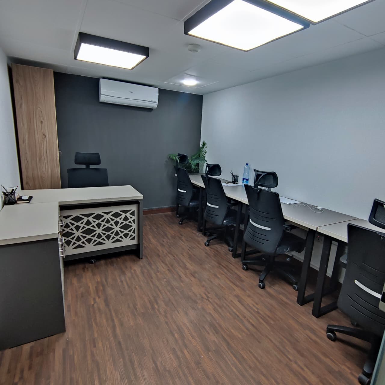 A private 5-person office with an executive-style desk at the head, built for leadership and collaboration. A private 5-person office with an executive-style desk at the head, built for leadership and collaboration.