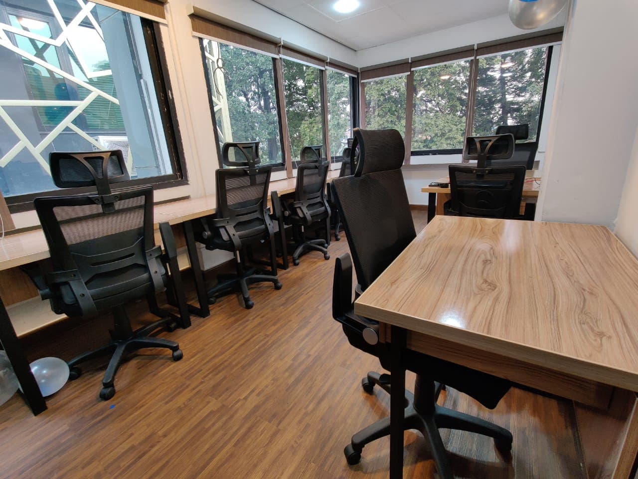 A modern 9-desk workspace offering comfort, privacy, and room for productivity. A modern 9-desk workspace offering comfort, privacy, and room for productivity.