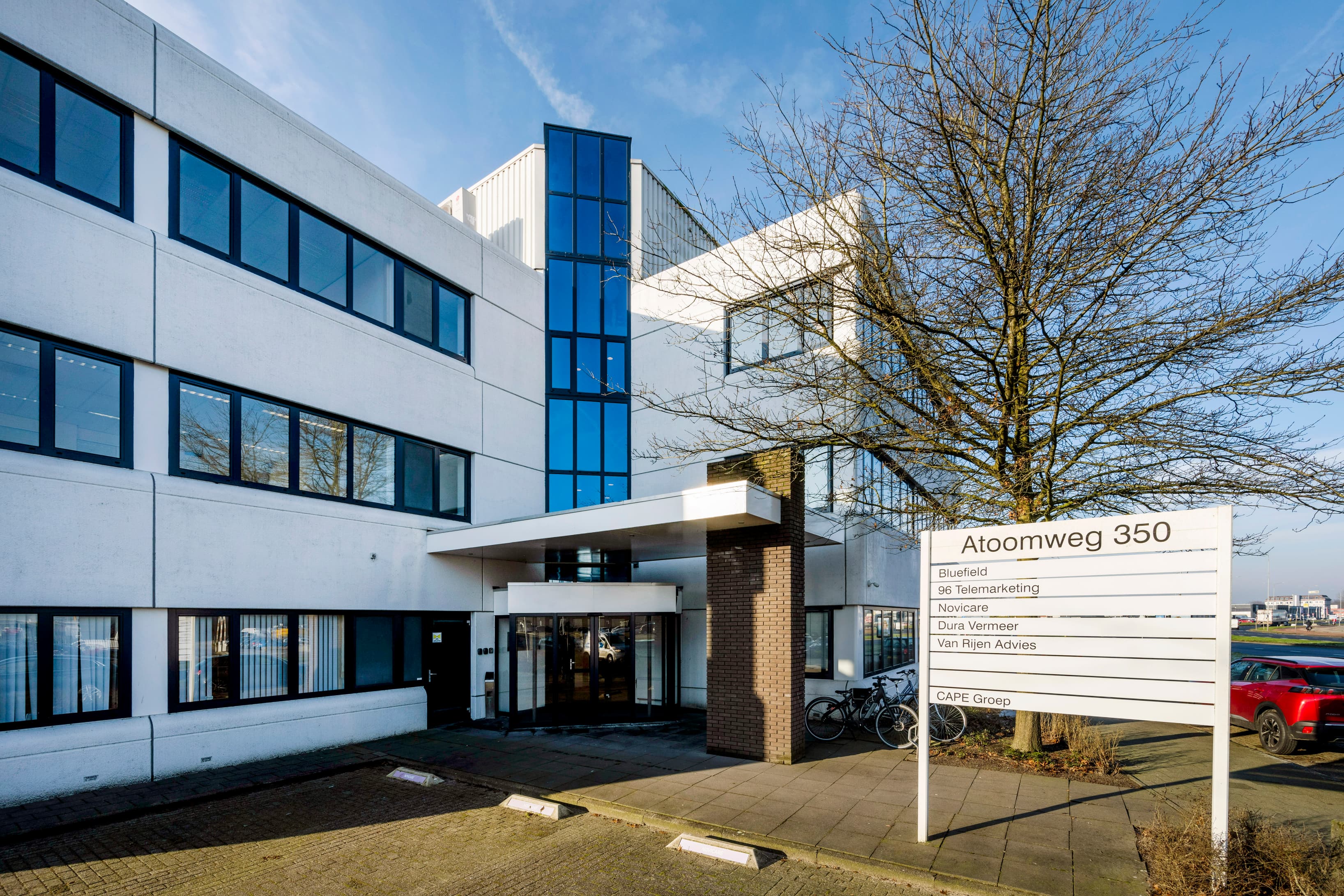 Main entrance of Atoomweg 350 in Utrecht, with clear building signage and convenient access for tenants and visitors