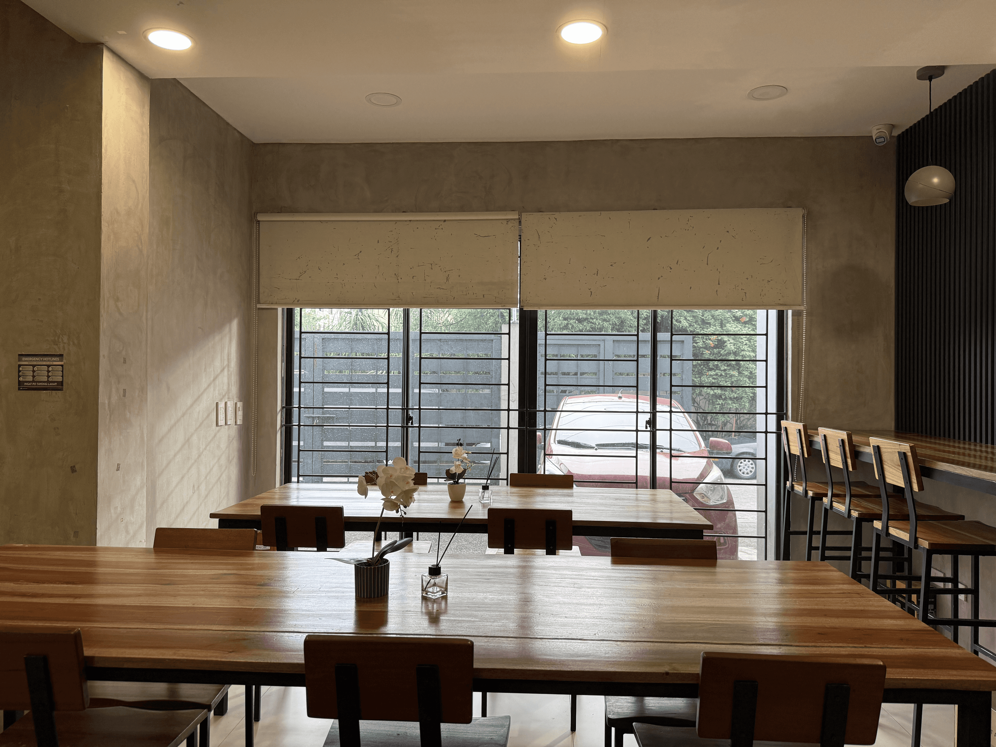Co-Working Space - A cozy workspace with spacious wooden tables and natural light for focused work. Co-Working Space - A cozy workspace with spacious wooden tables and natural light for focused work.