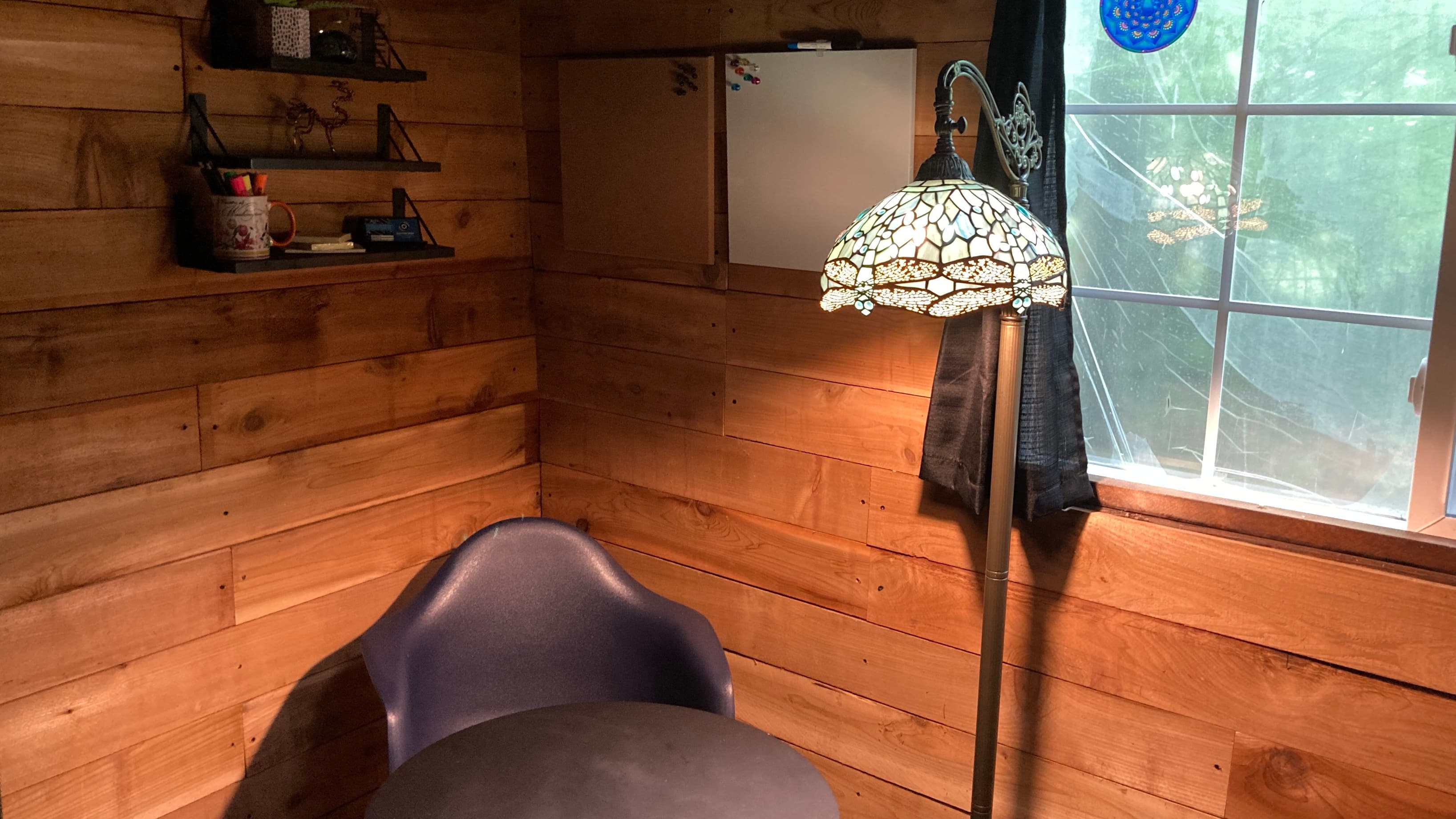 Corkboard and white board above work space.