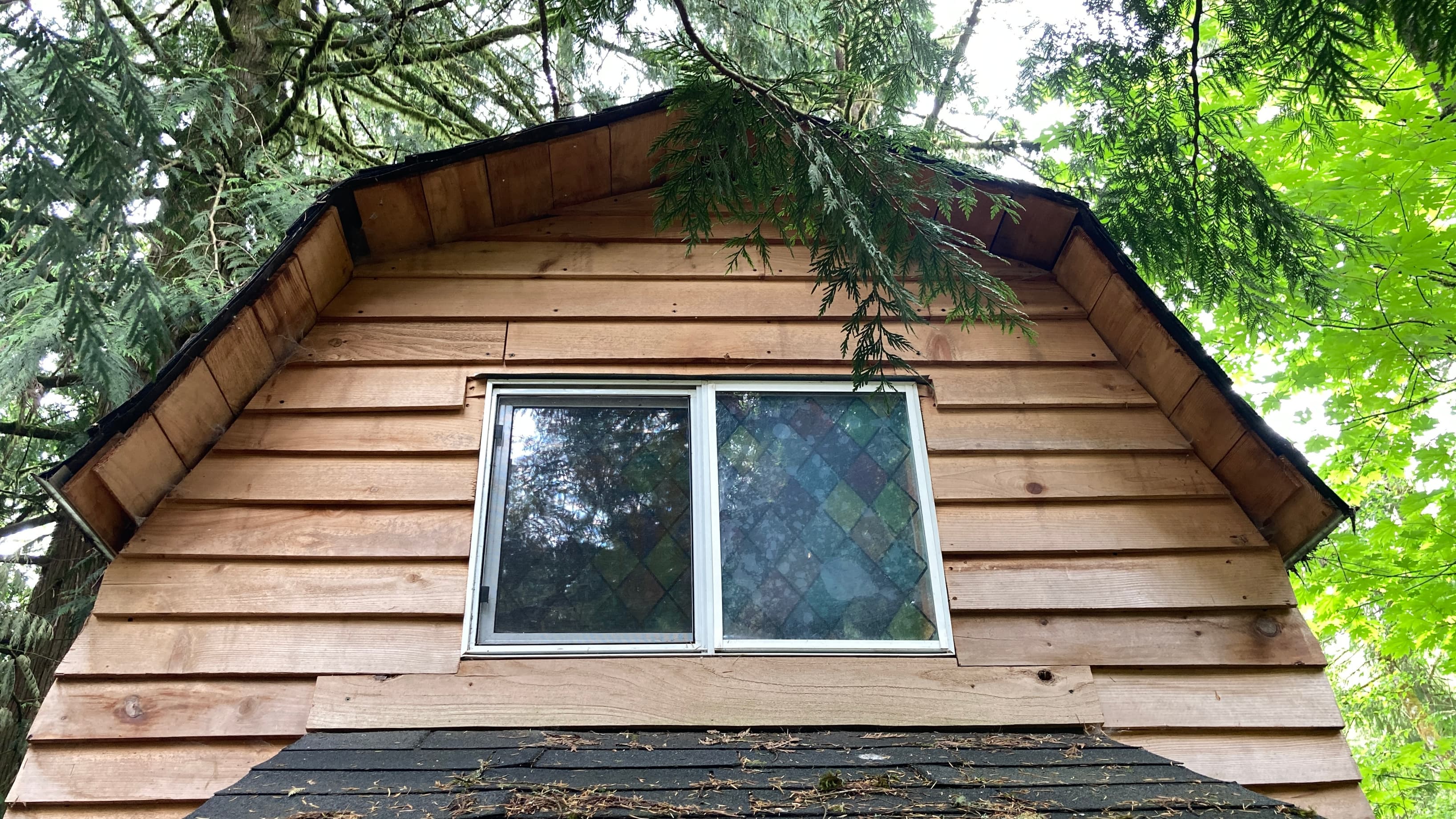 This gabled peaked roof gives this small studio an impressive sixteen foot ceiling. 