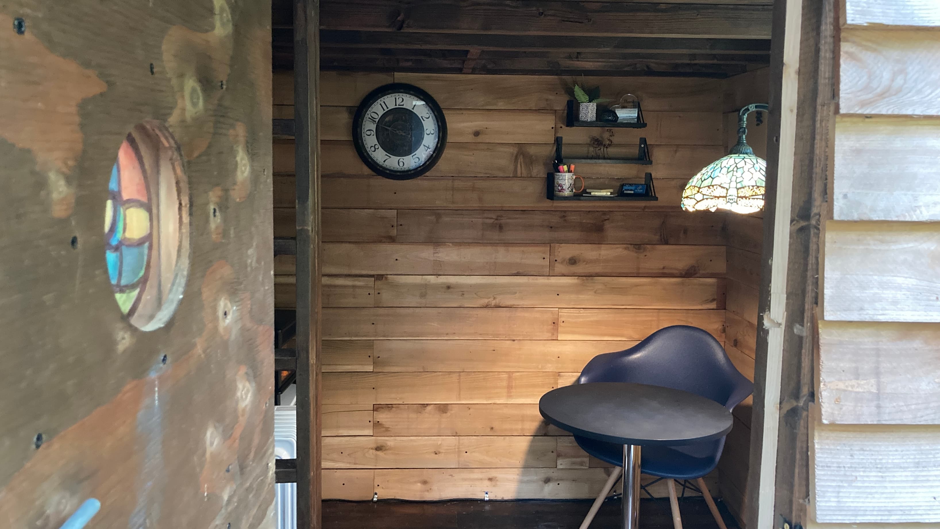 Through the door into the space.