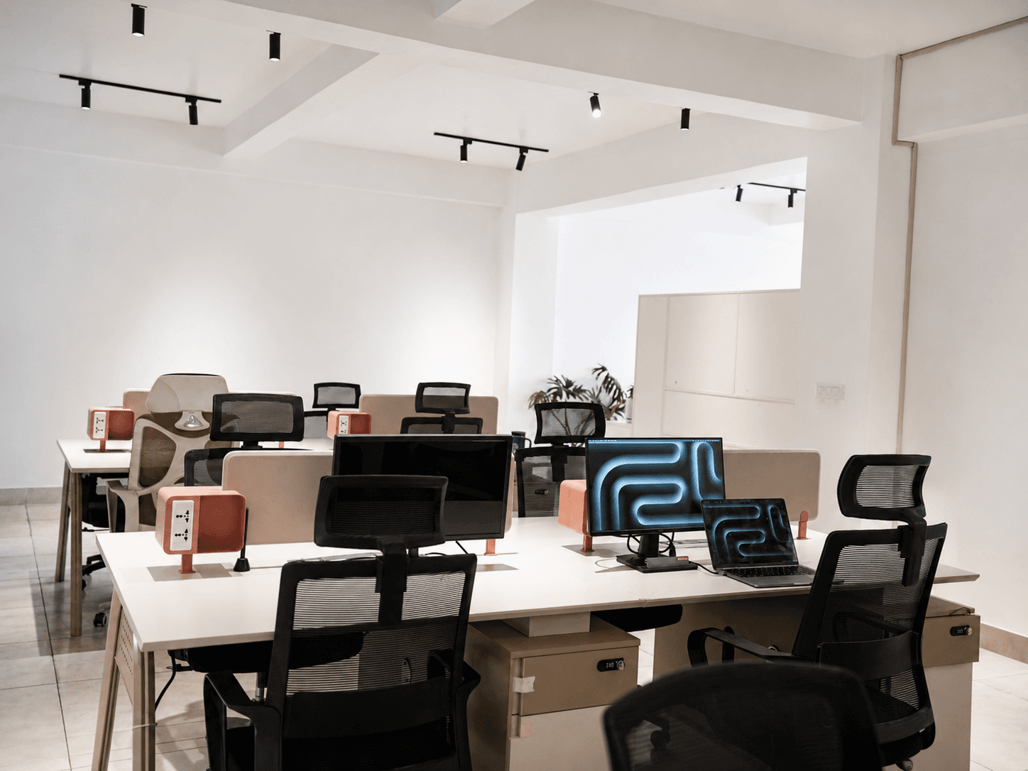 Wide desks, acoustic dividers, ergonomic chairs, and dedicated power at every seat. Just show up and get to work.