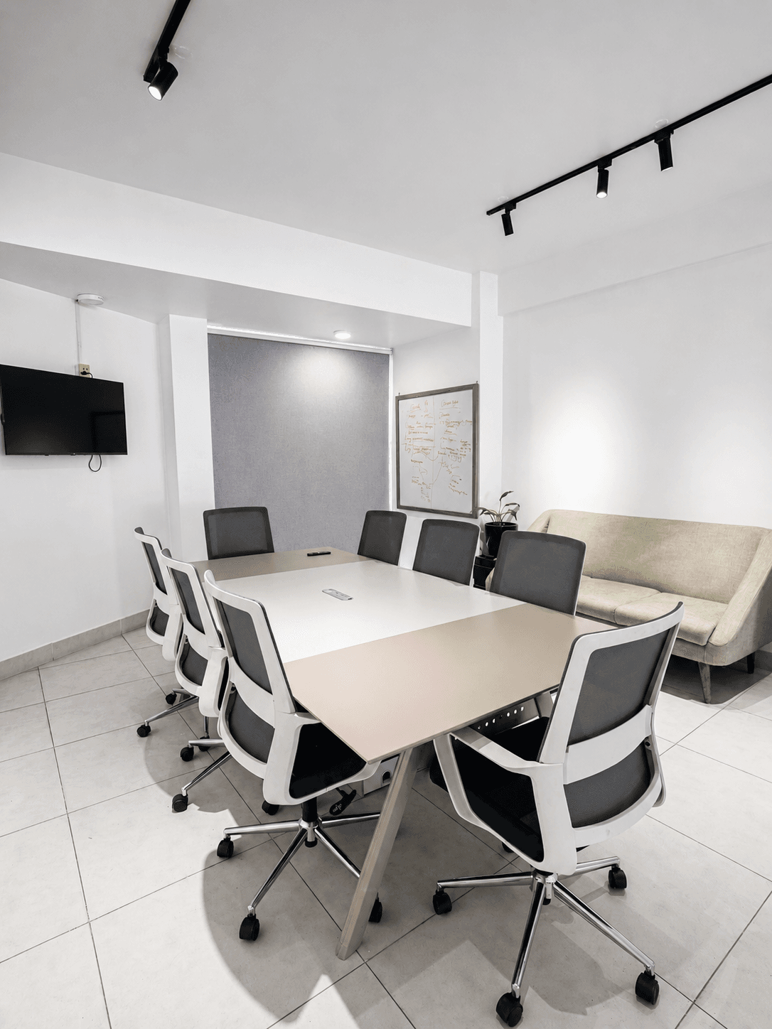 A proper meeting room that seats ten comfortably. Glass walls, clean setup, and everything you need to close the deal.