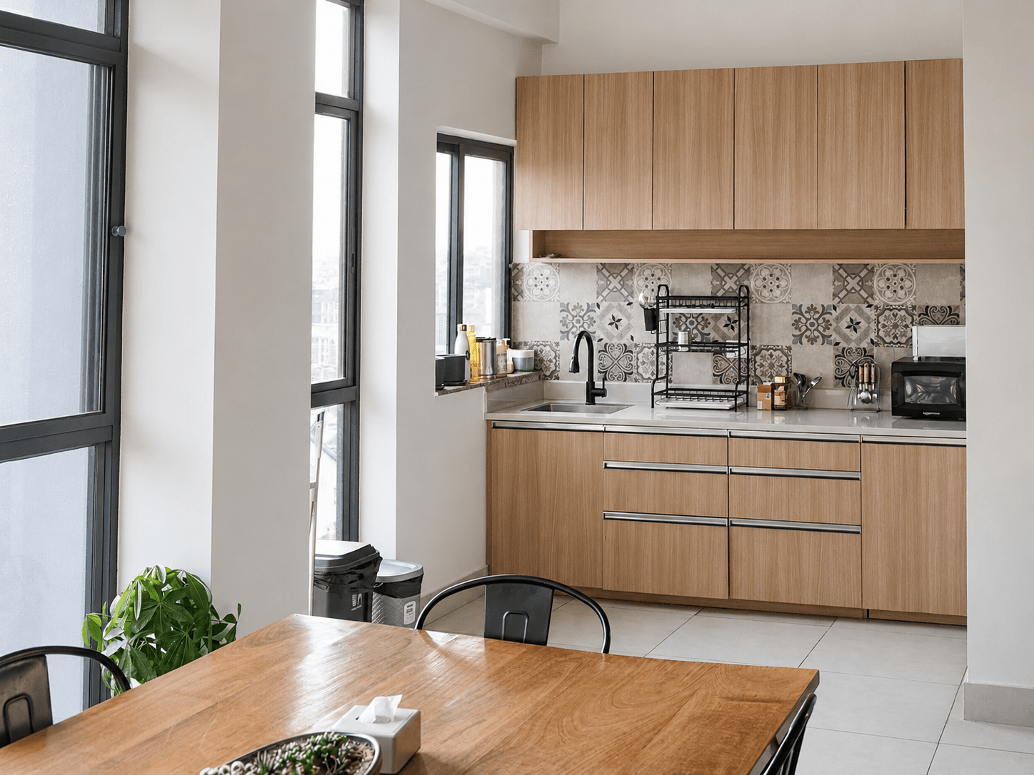 A warm, fully equipped kitchen with a timber dining table. Because a proper lunch break makes the rest of the day better.