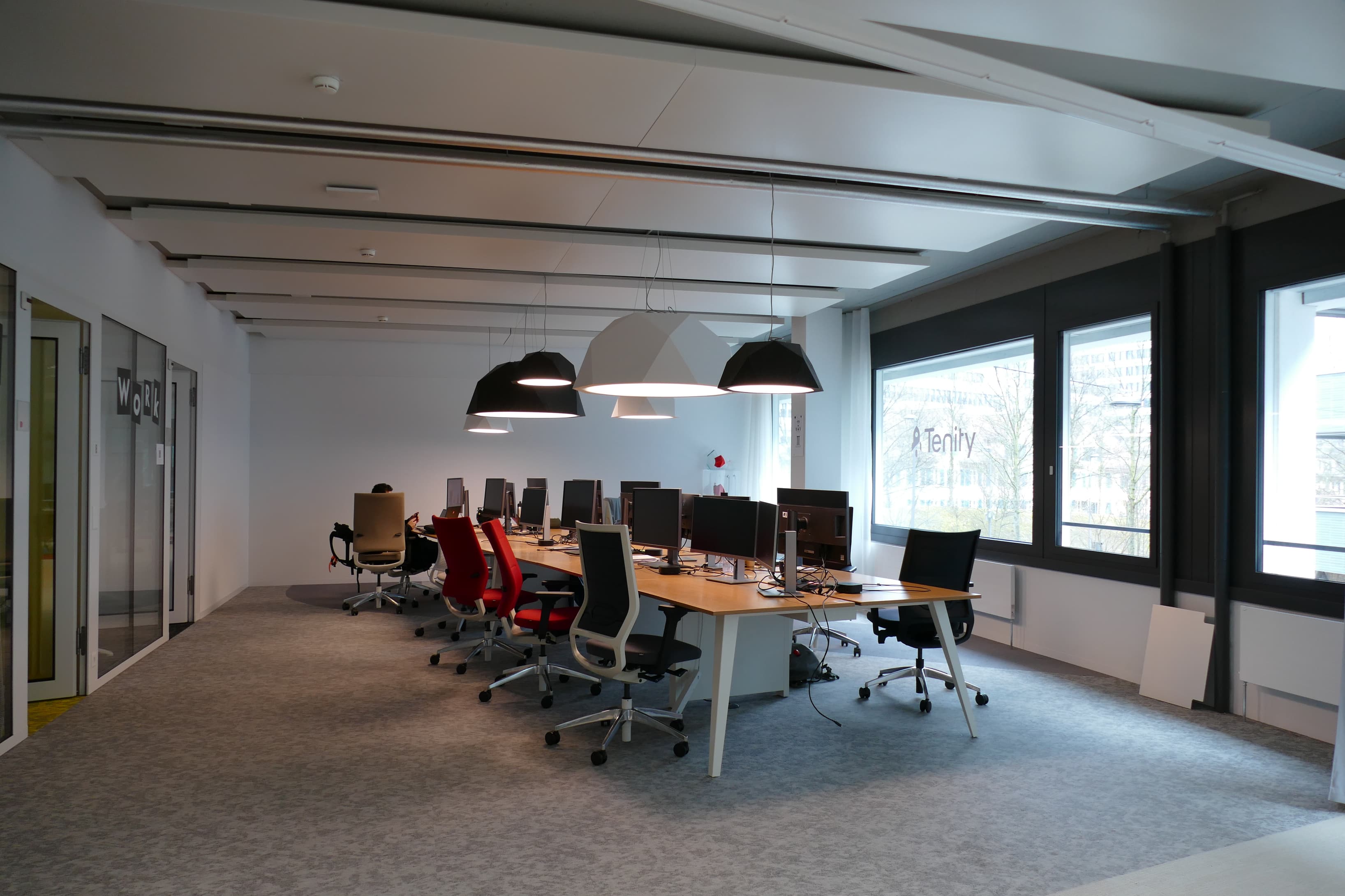Spacious coworking area with natural light, flexible seating options and access to shared amenities.