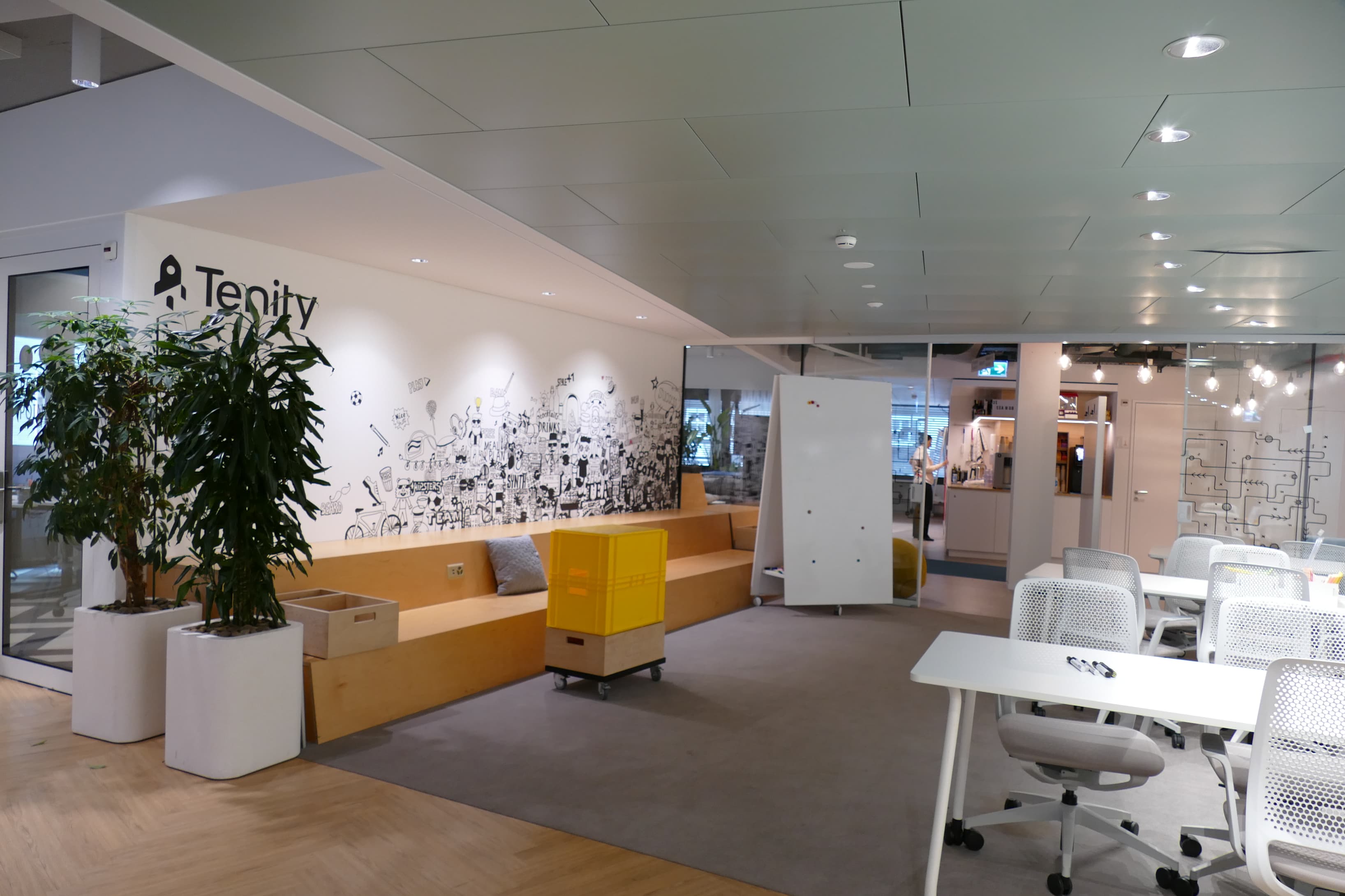 Open-plan workspace with access to private meeting rooms and collaboration areas. 