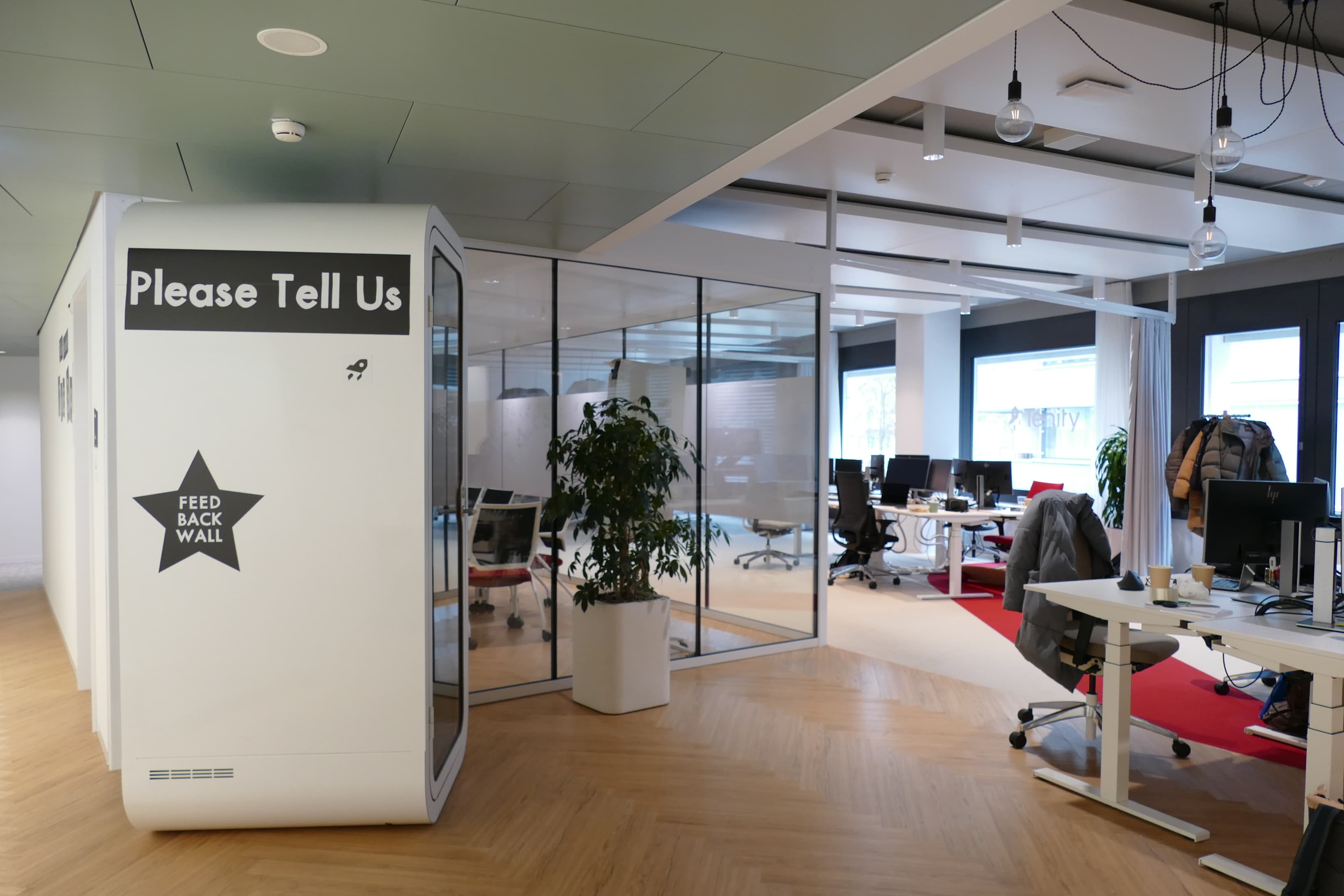 Open-plan workspace with access to private meeting rooms and collaboration areas. 