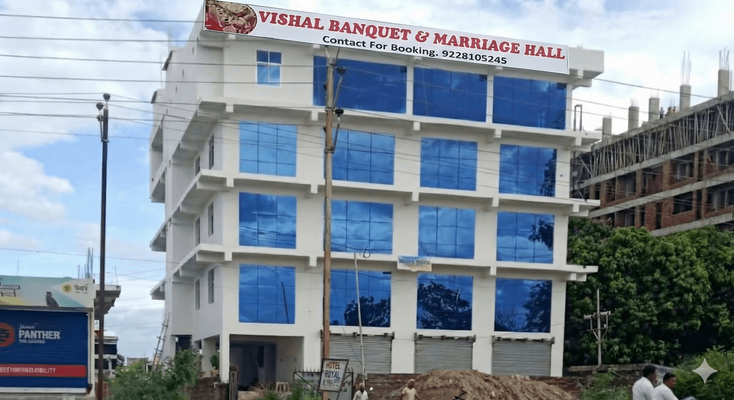 Front exterior view of Vishal Banquet & Marriage Hall, Bodh Gaya — a modern multi-floor event venue with easy road access