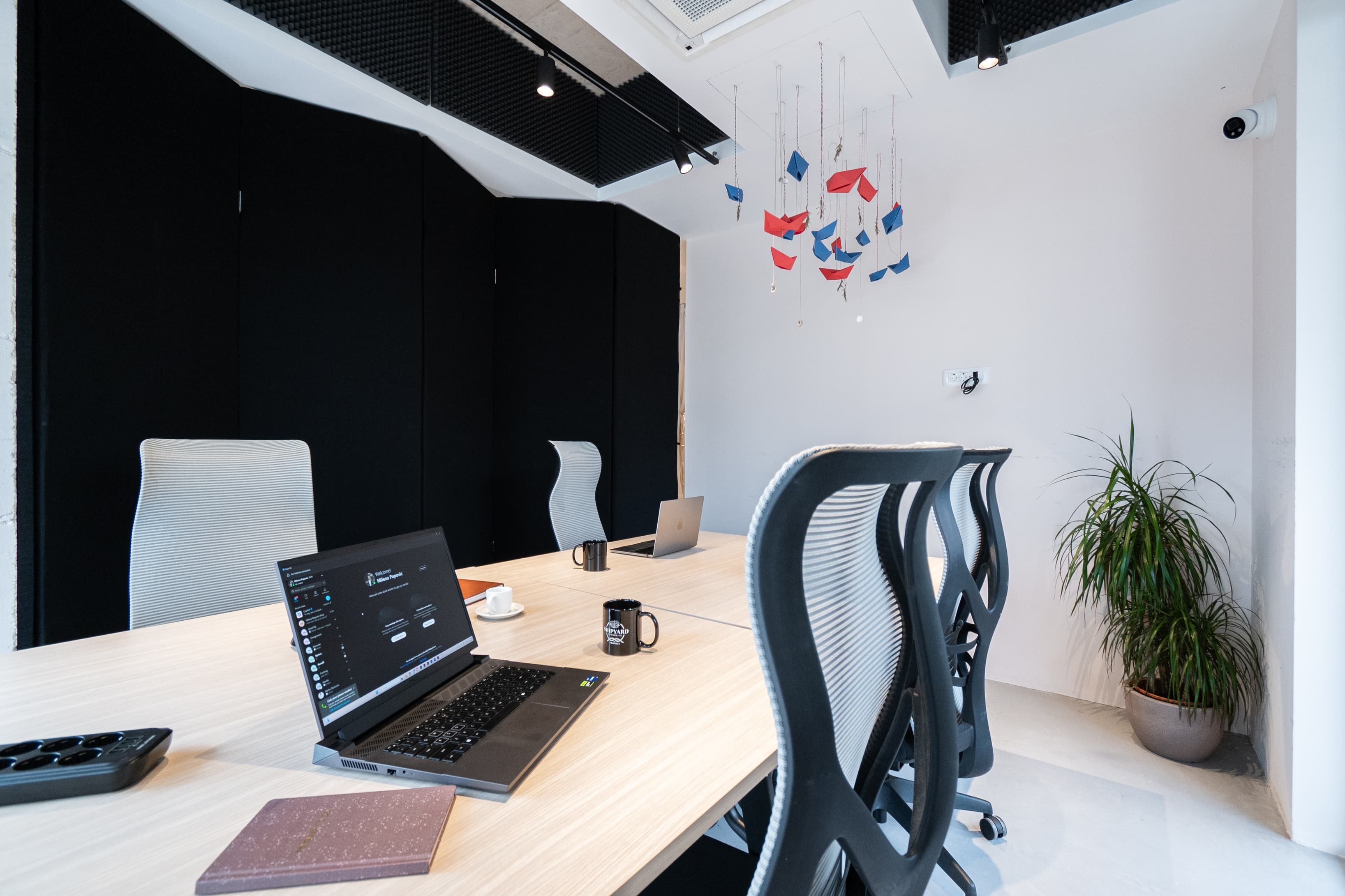 Private meeting room with round table set up and comfortable seating for private sessions.