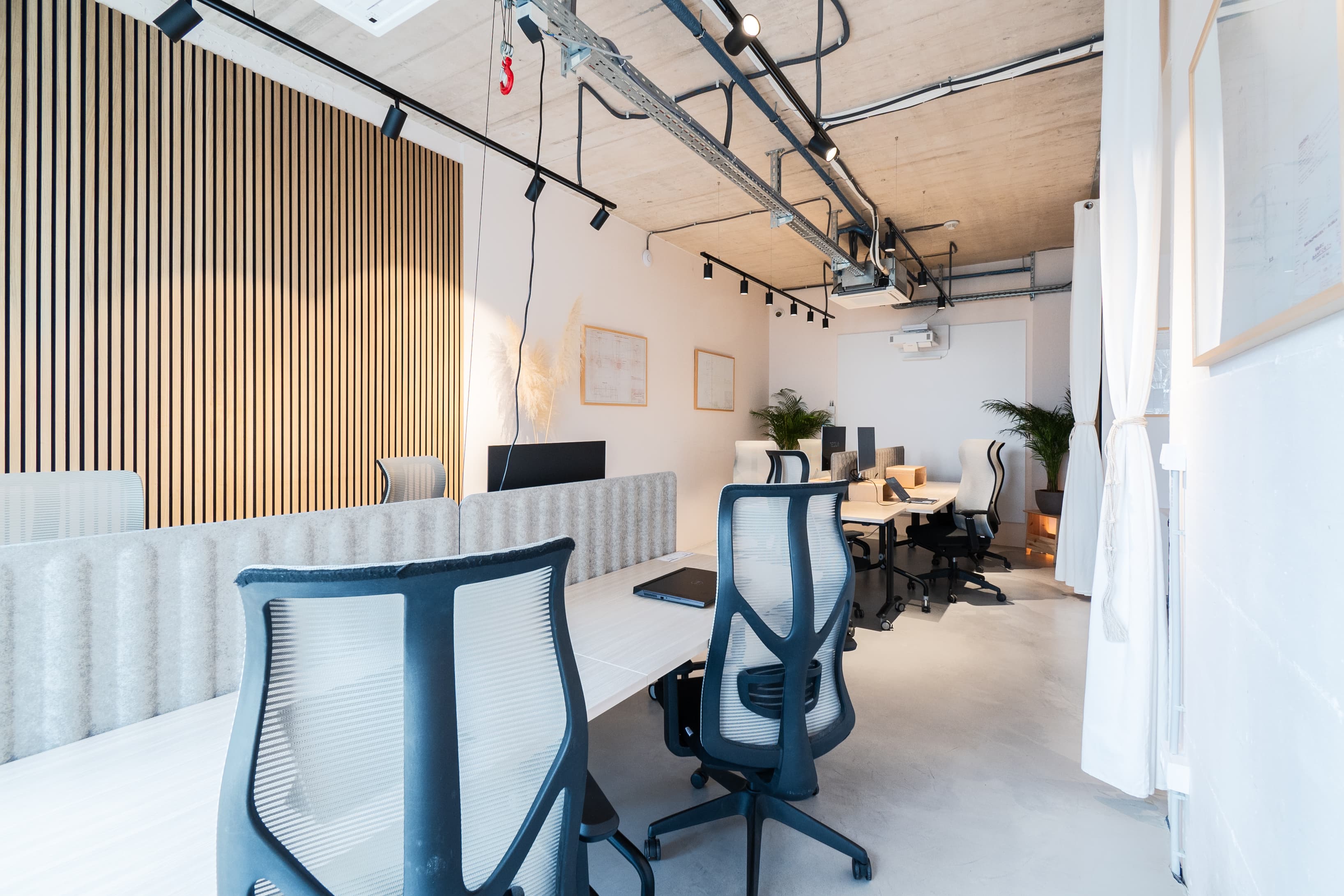 Open coworking area with modern design and plenty of natural light.