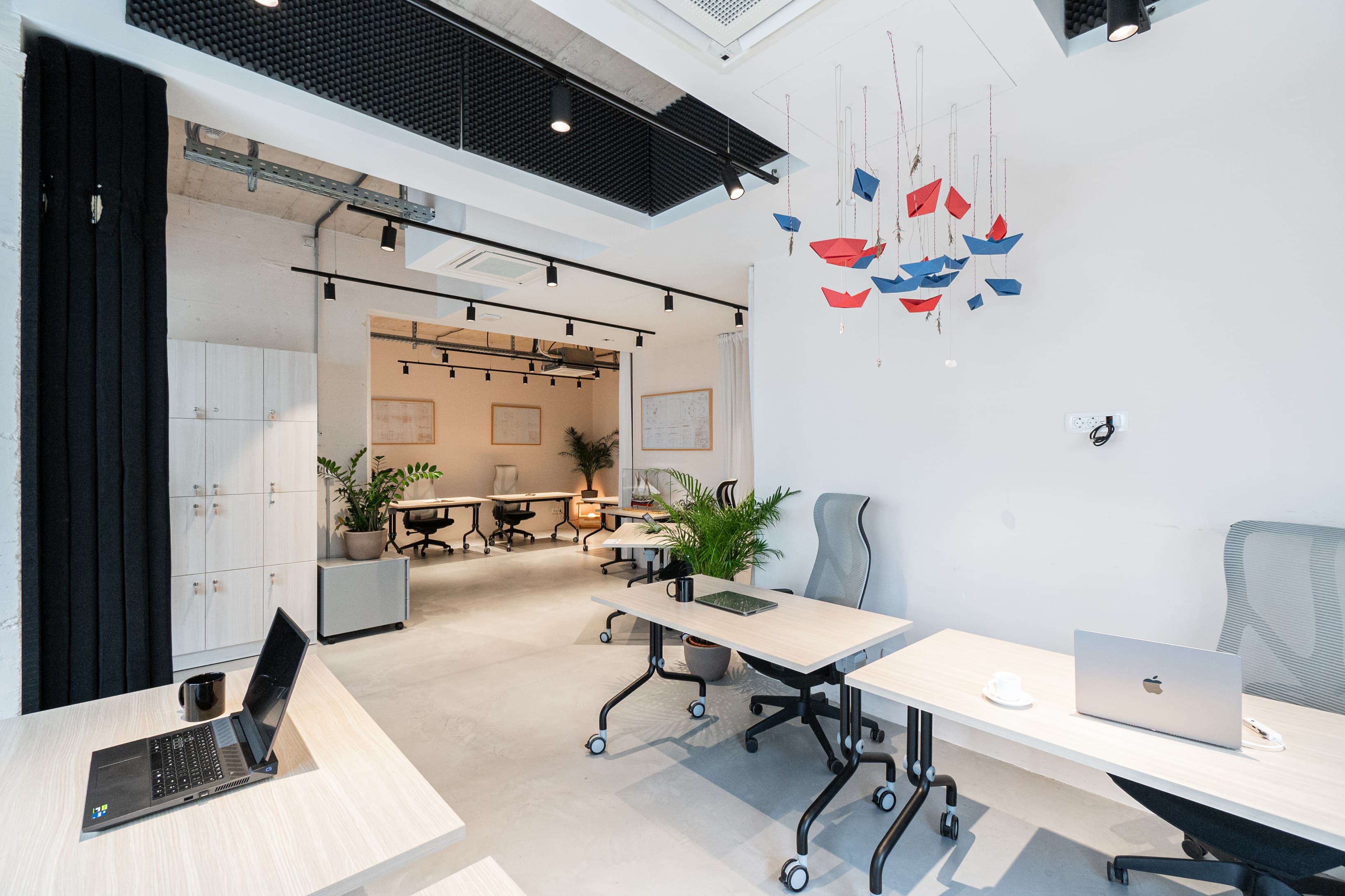 Open-plan coworking area with creative design and collaborative atmosphere.
