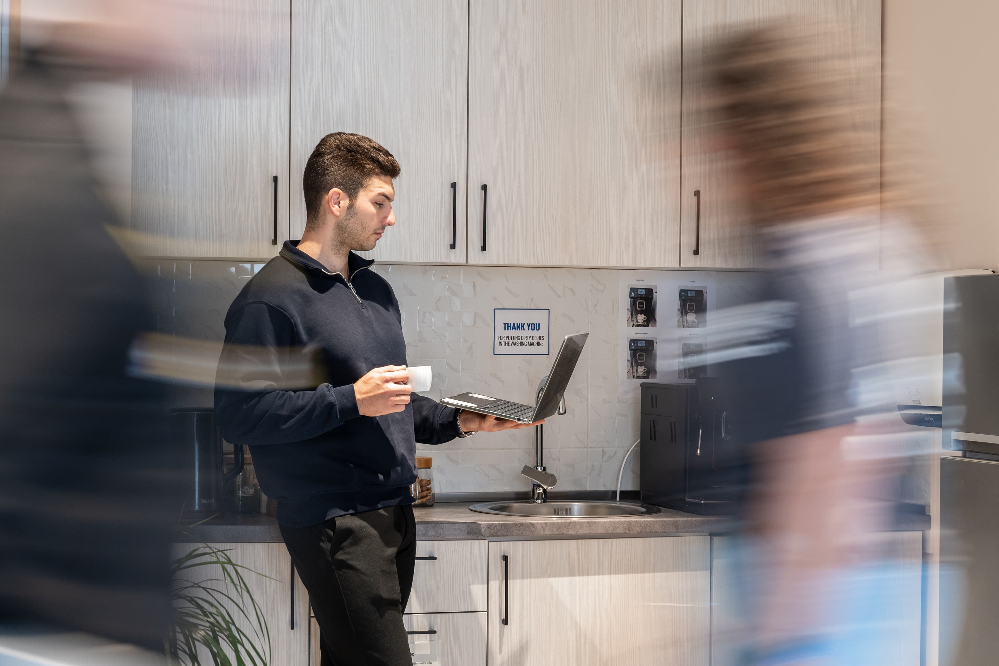 Community kitchen area where members can connect over coffee or lunch.