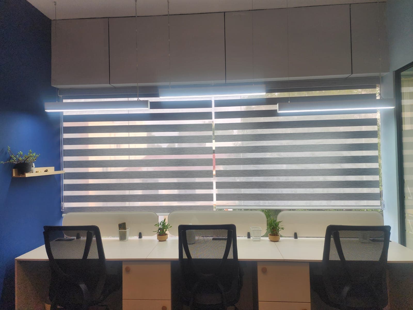 “Bright and vibrant 3-seater workspace near the window, designed to boost productivity with natural light and a refreshing am