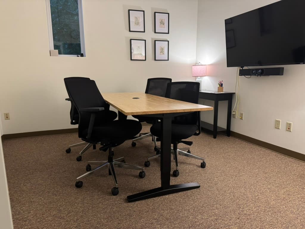 Conference room with TV and video bar, seats 4 Conference room with TV and video bar, seats 4