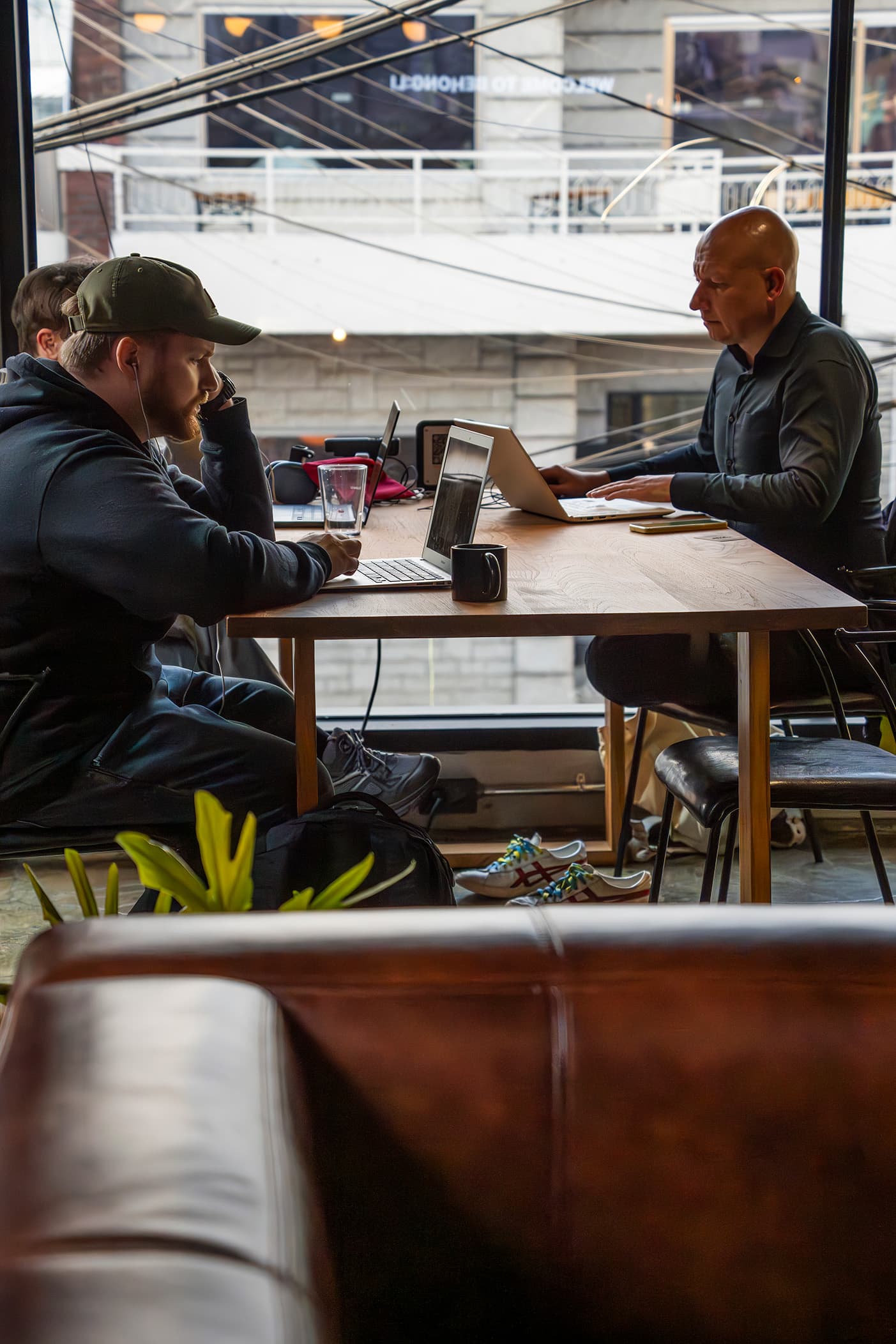 A shared table for meetings and casual work sessions. A shared table for meetings and casual work sessions.