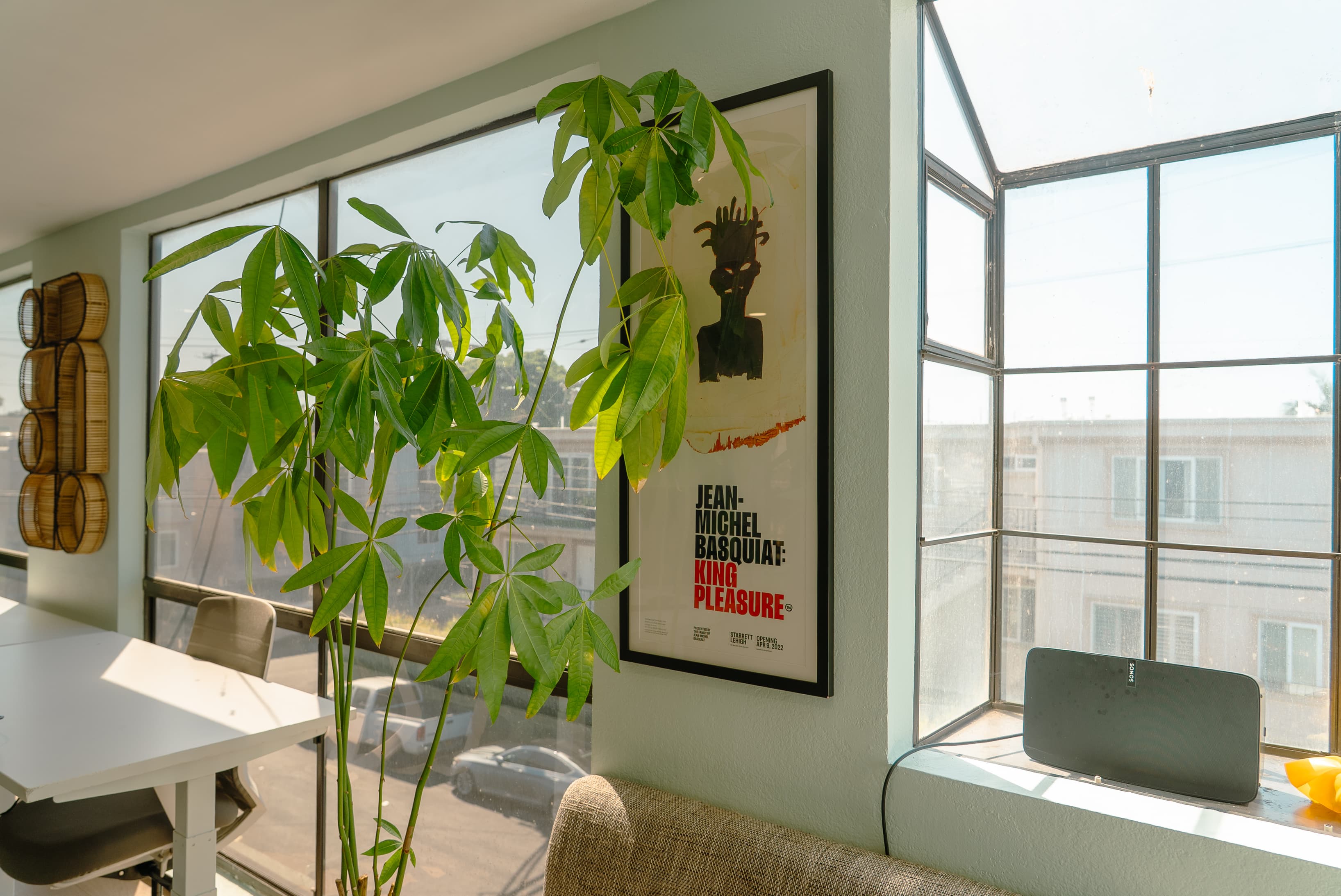 Bright and open co-working area with natural light, comfortable seating, and a clean, modern layout designed for productivity
