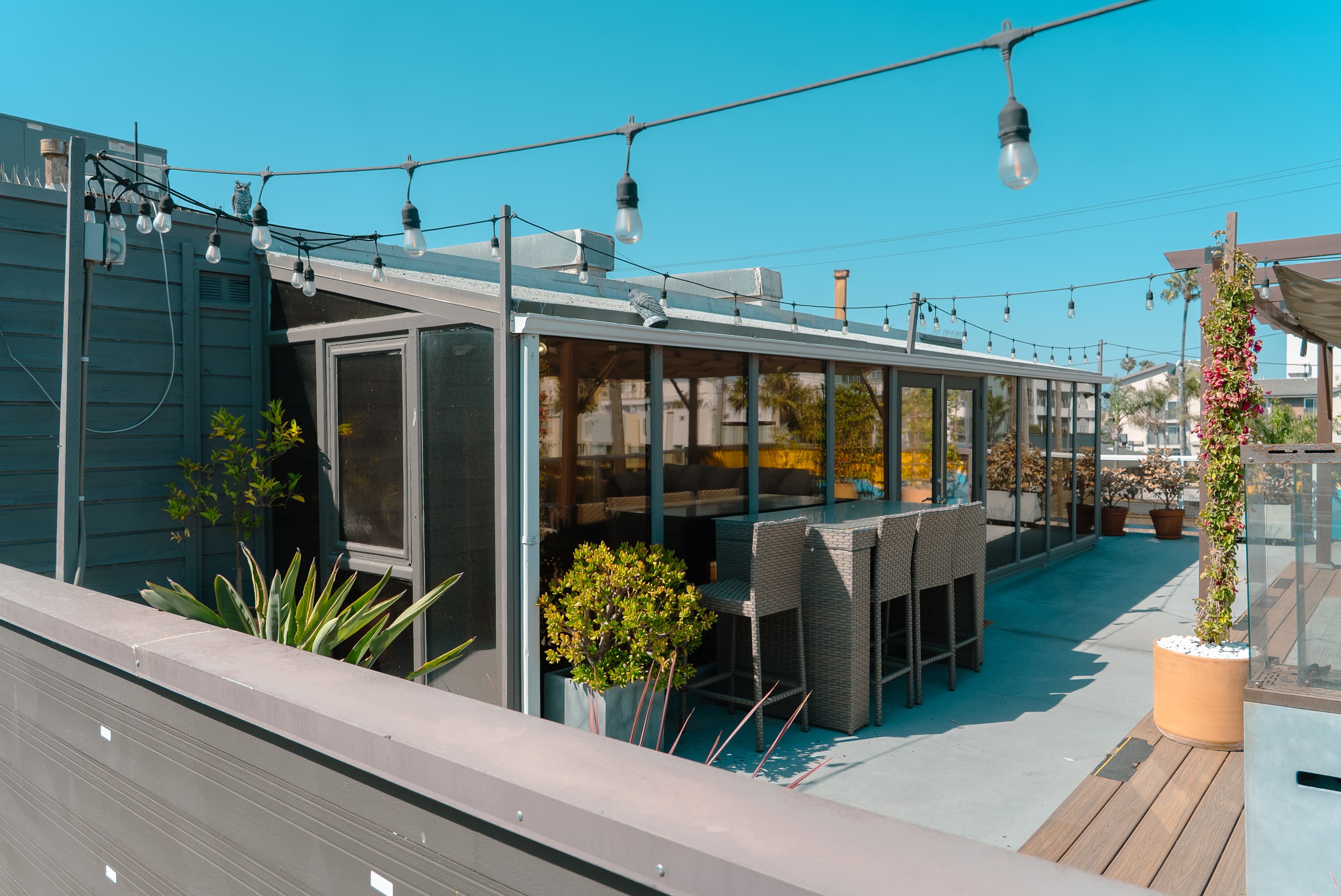 Relaxing outdoor space with a fresh, airy atmosphere, perfect for breaks, casual meetings, or small gatherings.