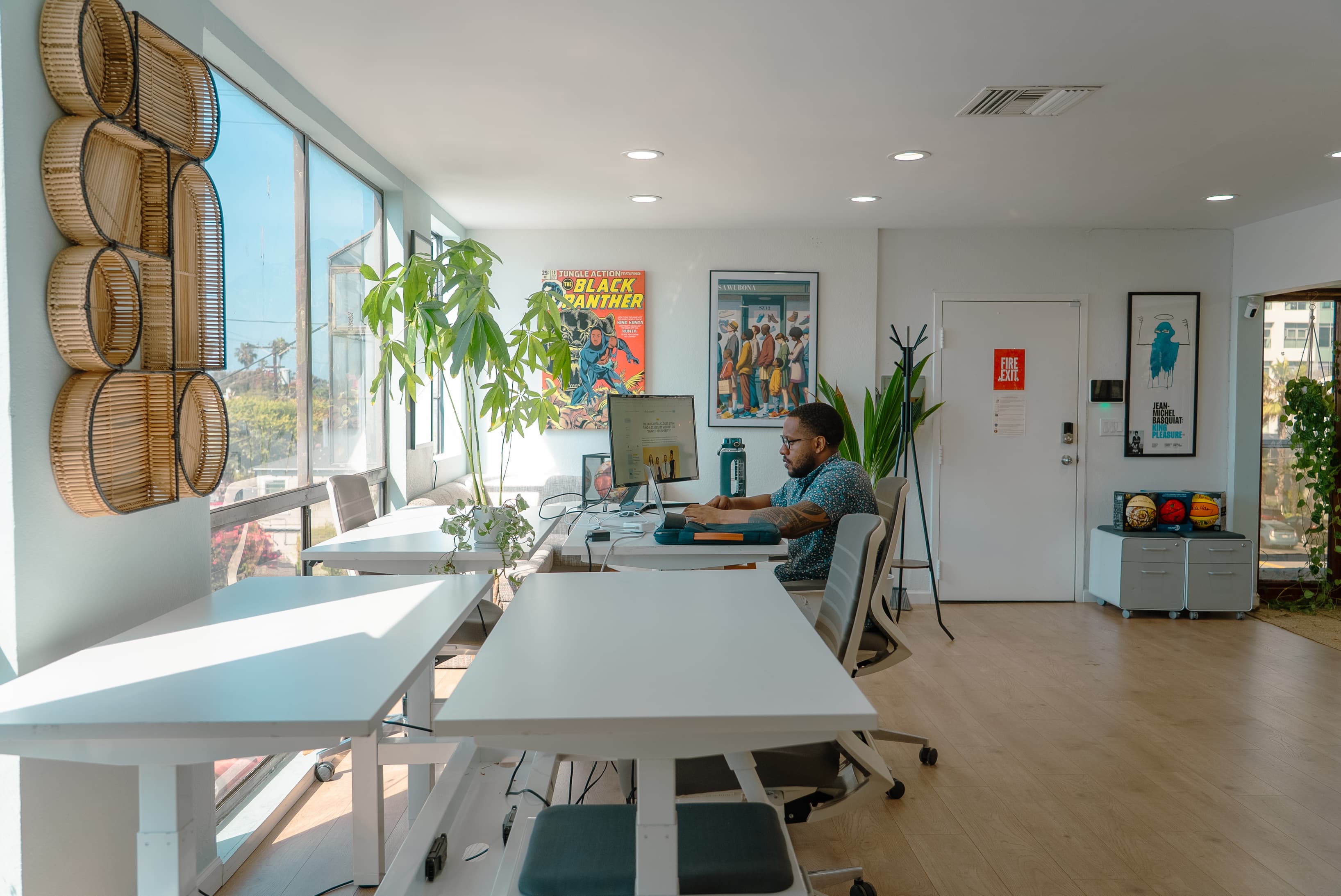People engaging in work, collaboration, or events, highlighting the community-driven and creative energy of the space.
