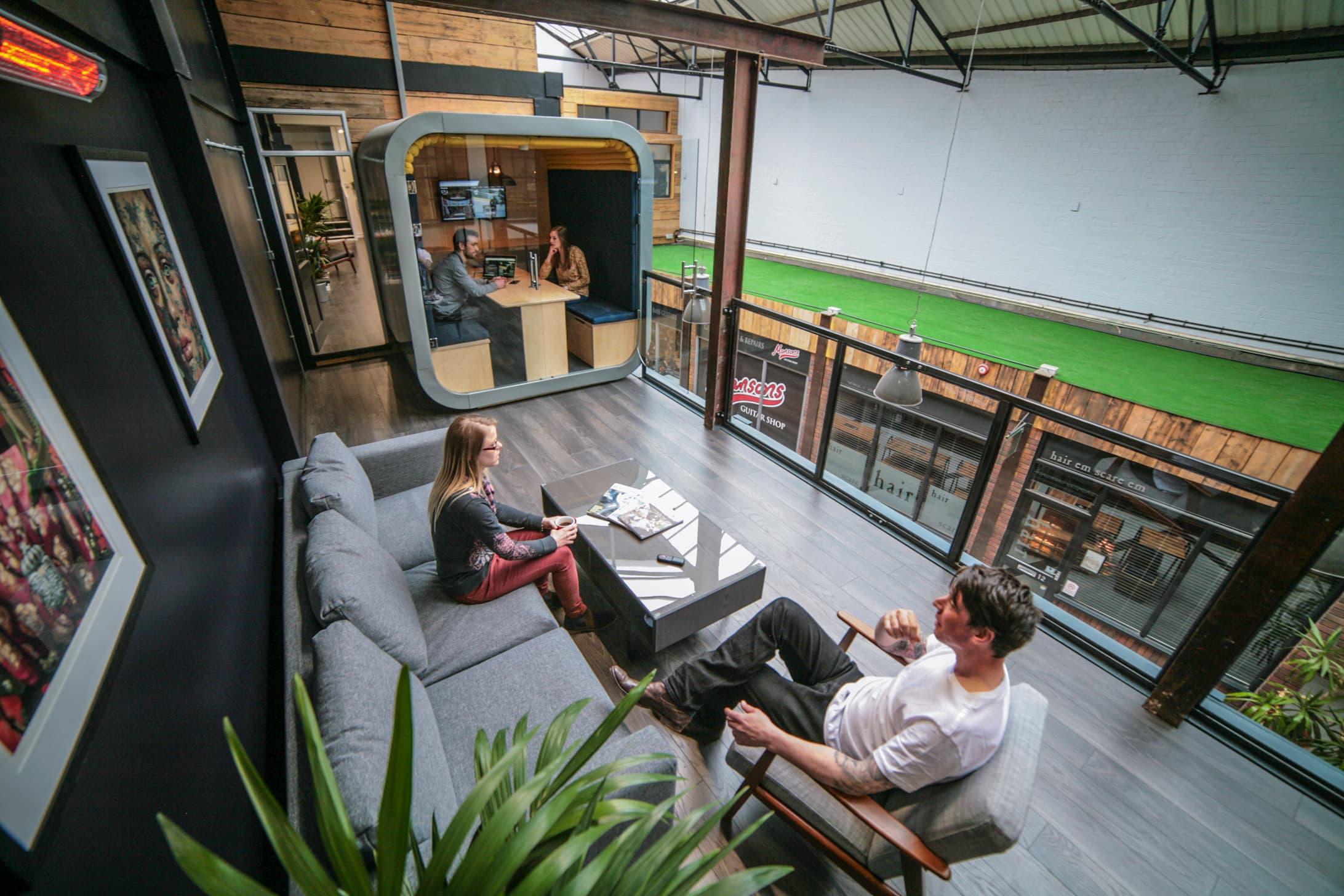 The breakout space, balcony, and private meeting pod The breakout space, balcony, and private meeting pod