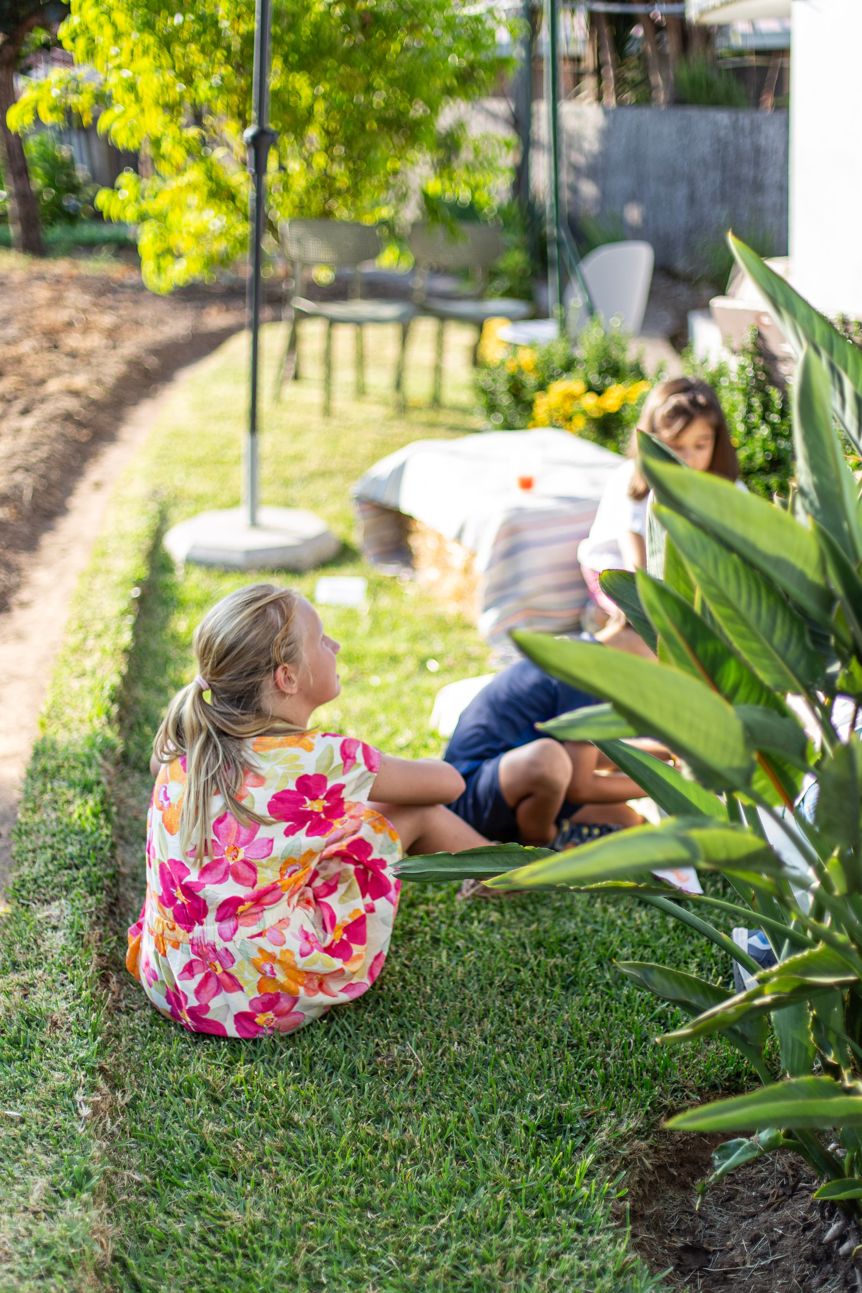 Kids playing in the garden Kids playing in the garden