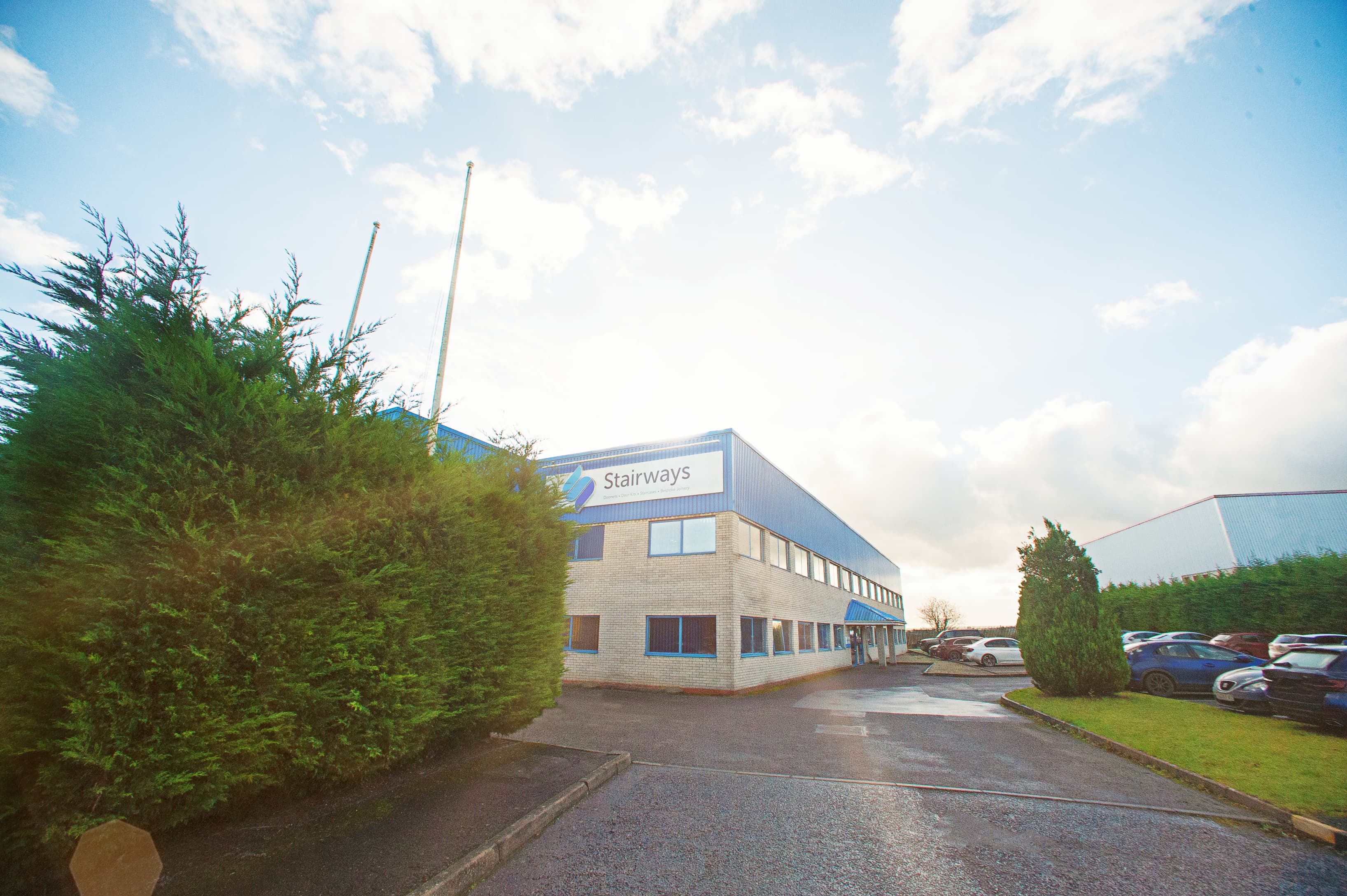 approach to main building with car park in front.