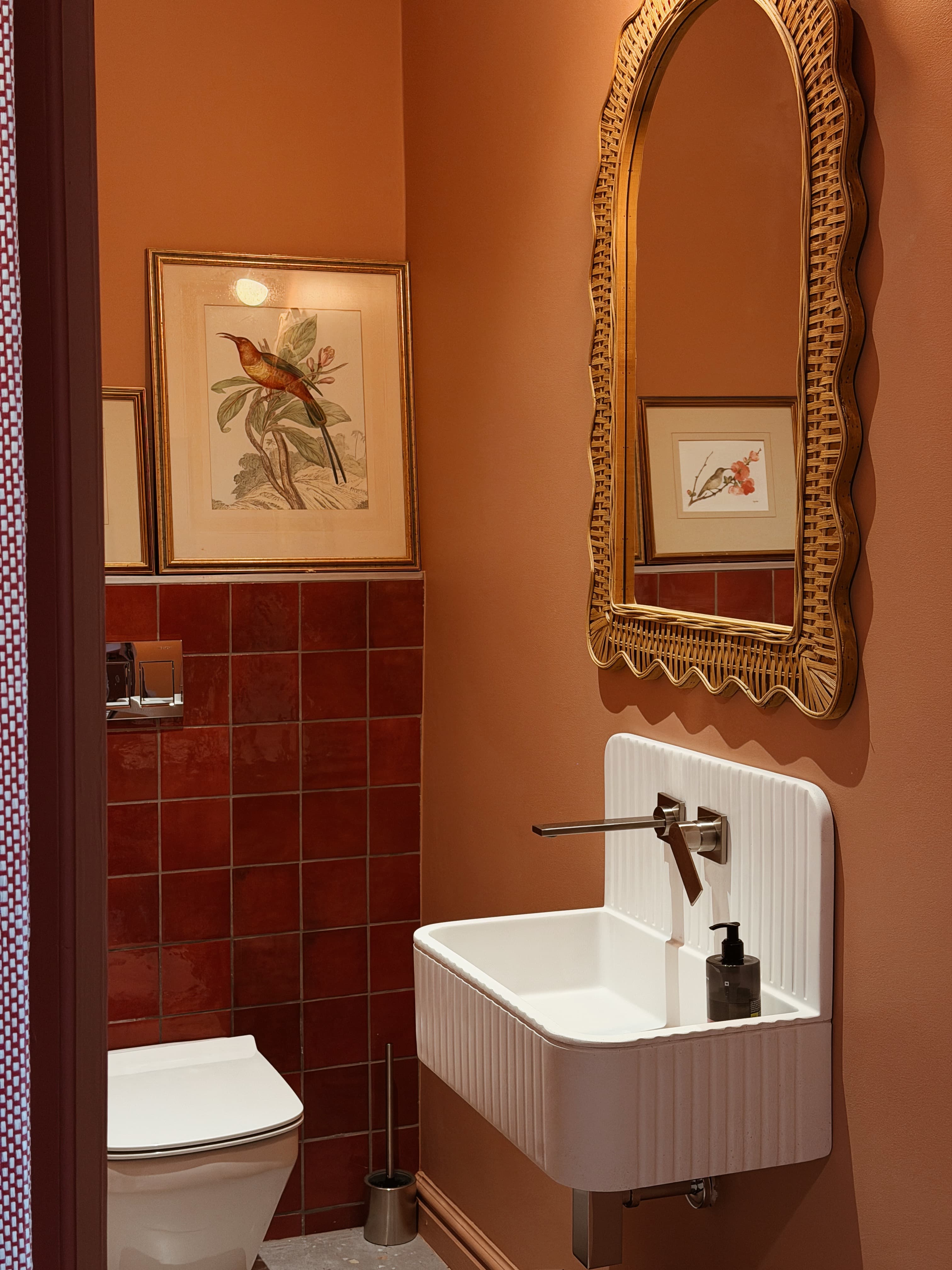 Thoughtfully designed bathroom with warm terracotta finishes and considered details.