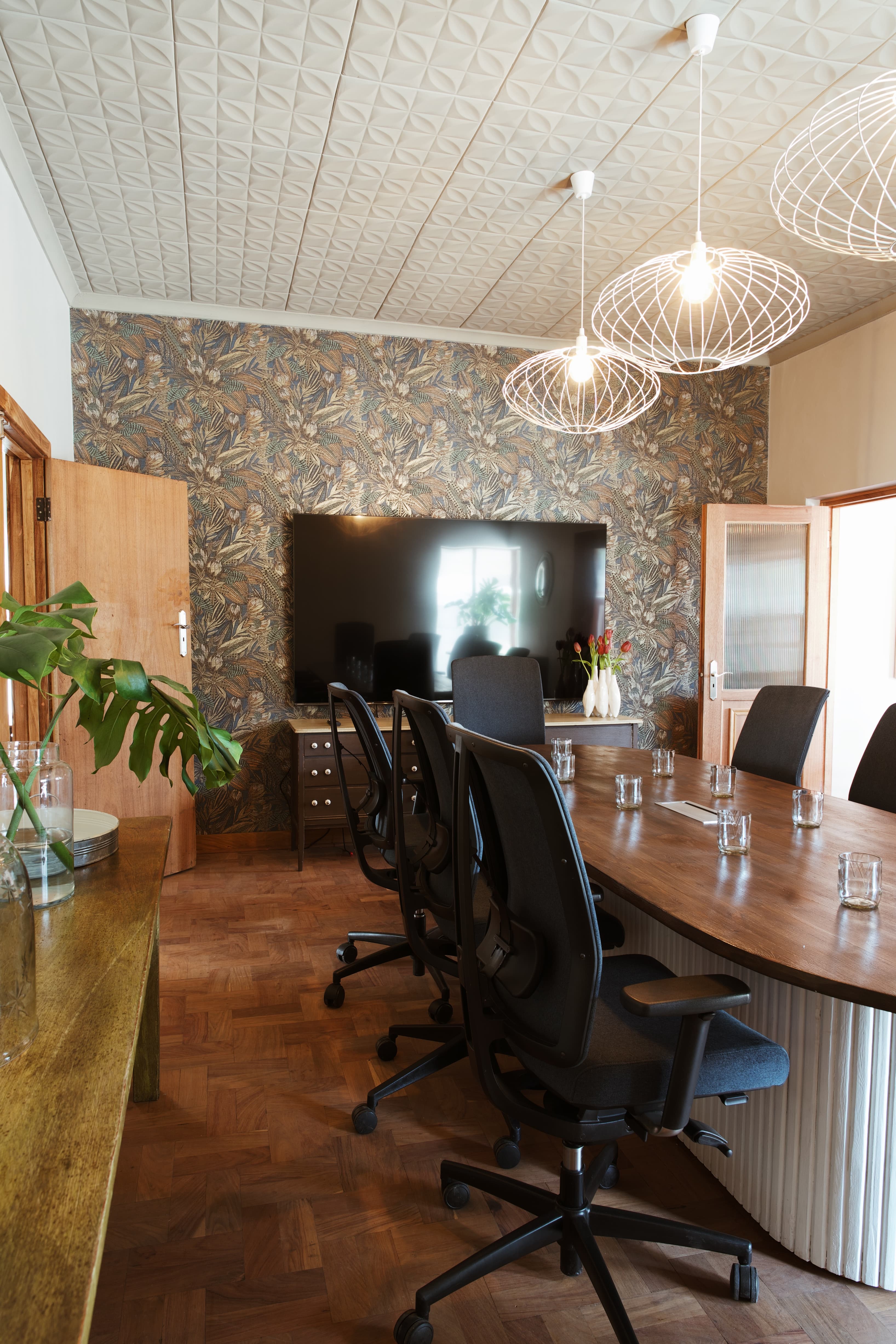 Spacious 12-person boardroom with large screen, high-speed Wi-Fi and plenty of natural light.