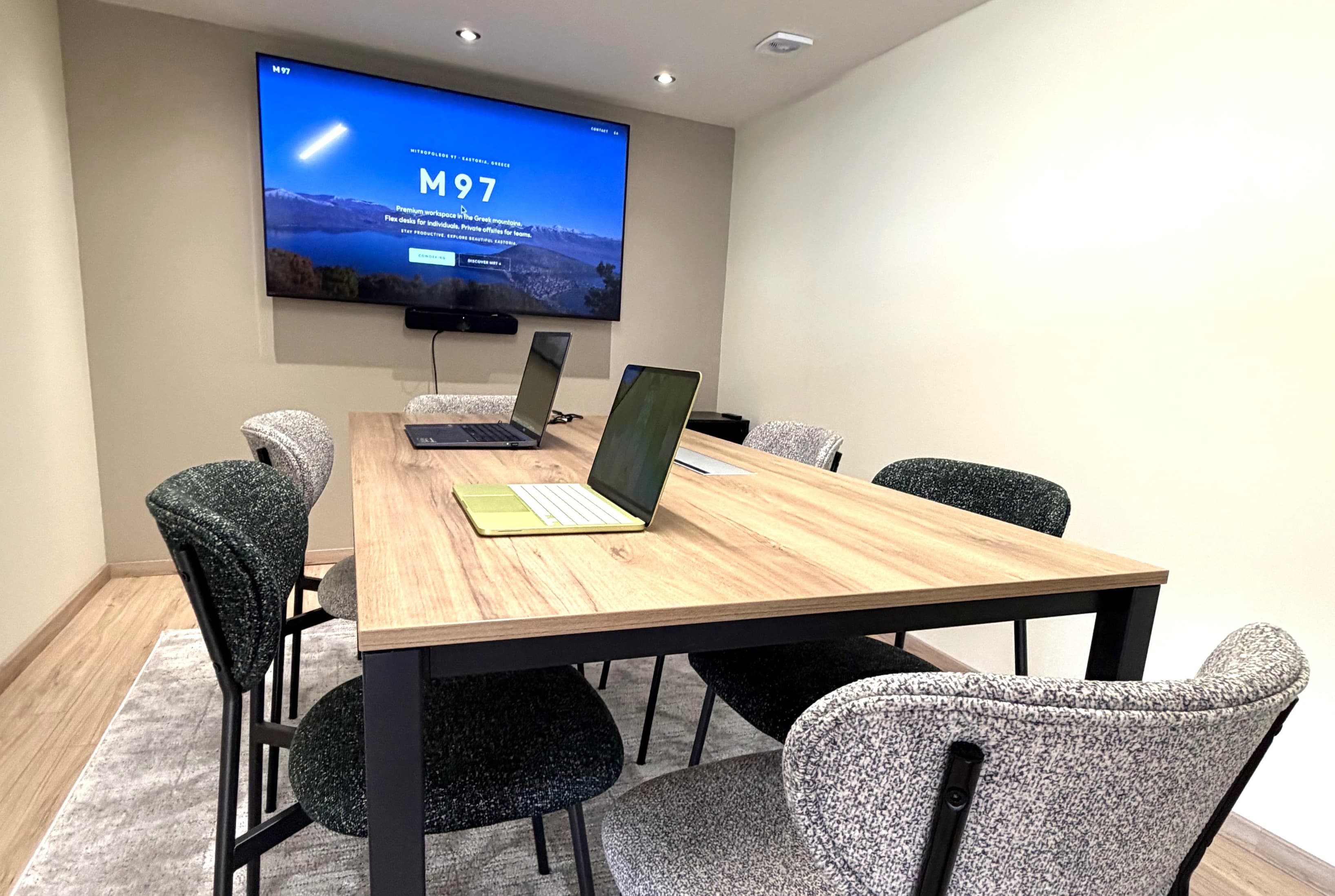 Private meeting room with modern audio-visual equipment.