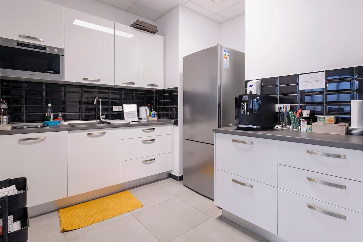 Two full kitchens with full sized fridges.