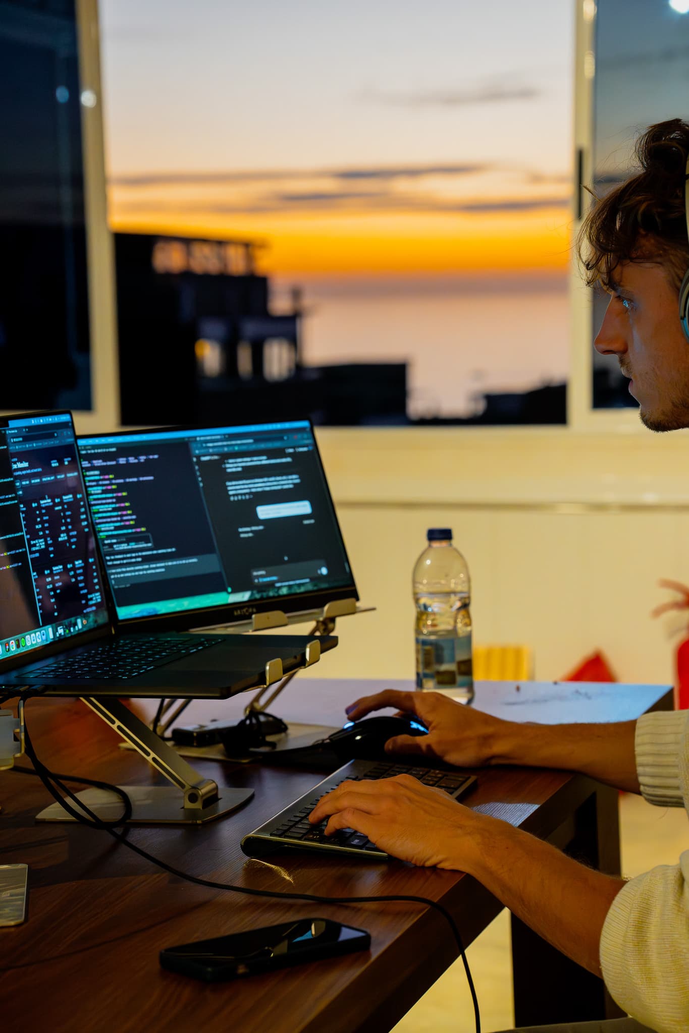 Developer deep in code at Amsiln Studio with fast internet, proper setup, and zero distractions for serious work.