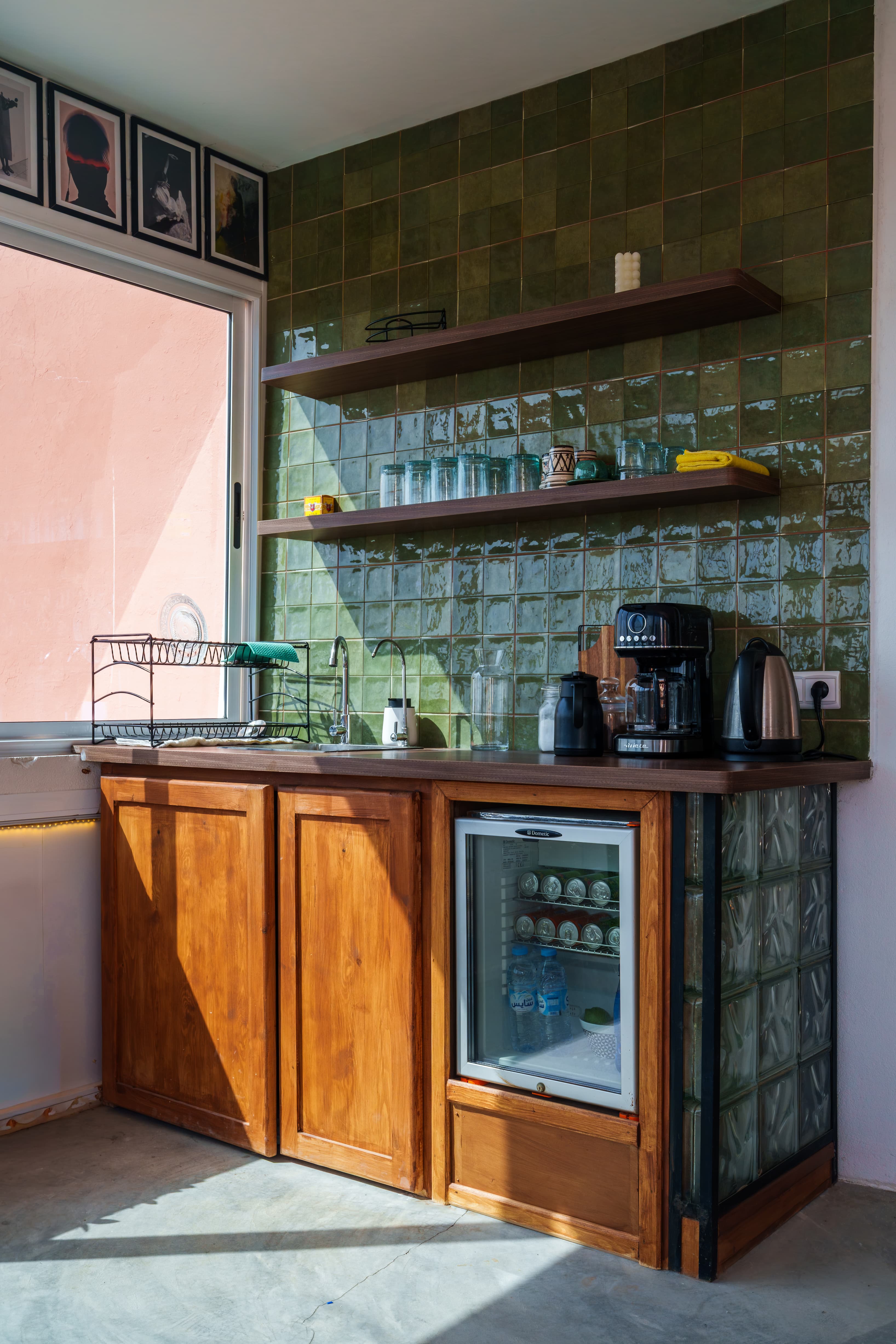 Kitchen at Amsiln Studio with free coffee, tea, filtered water, and a stocked fridge—everything you need to keep going.