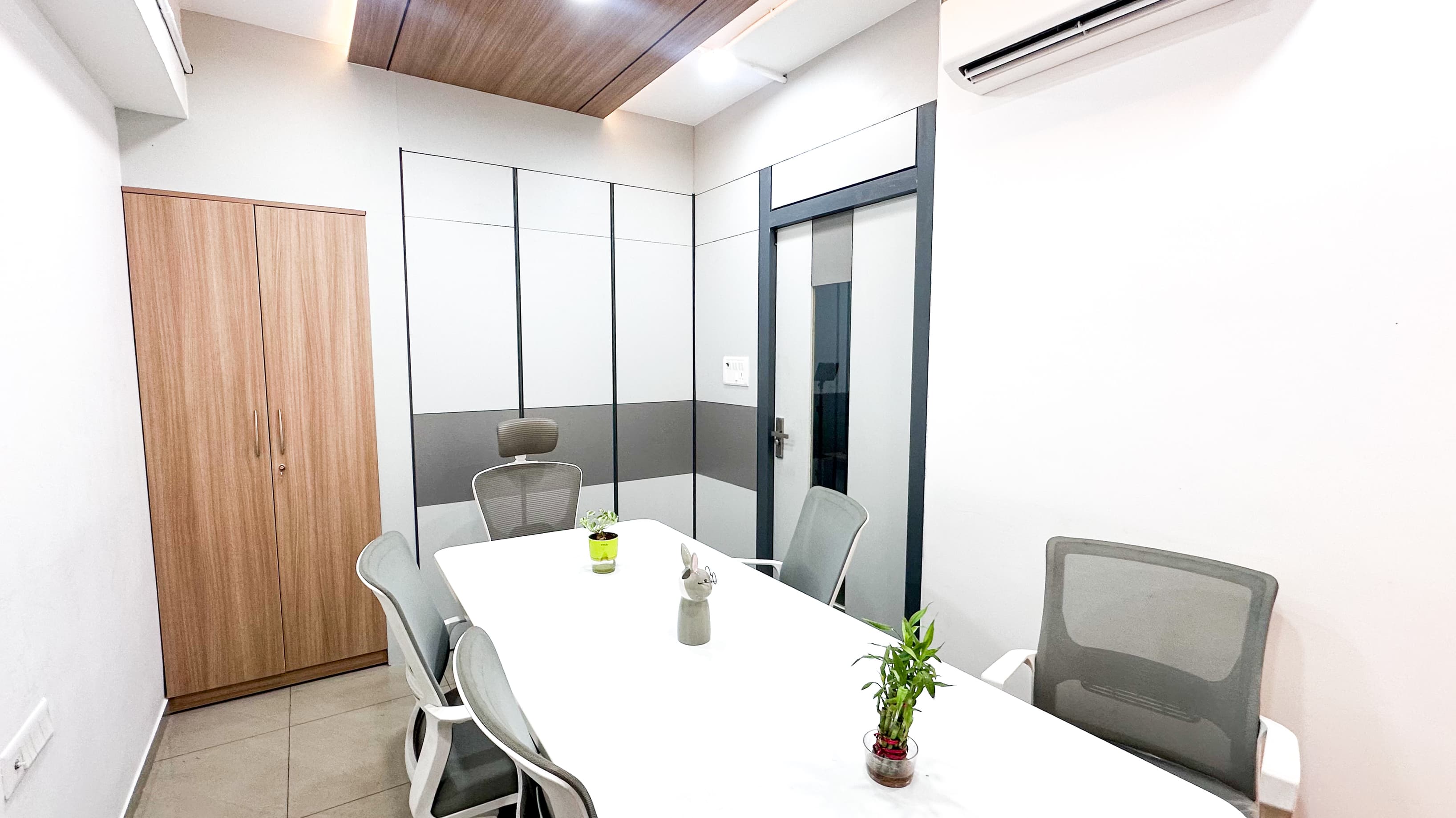 A professional meeting space designed for team discussions, client meetings, and presentations, equipped with comfortable sea